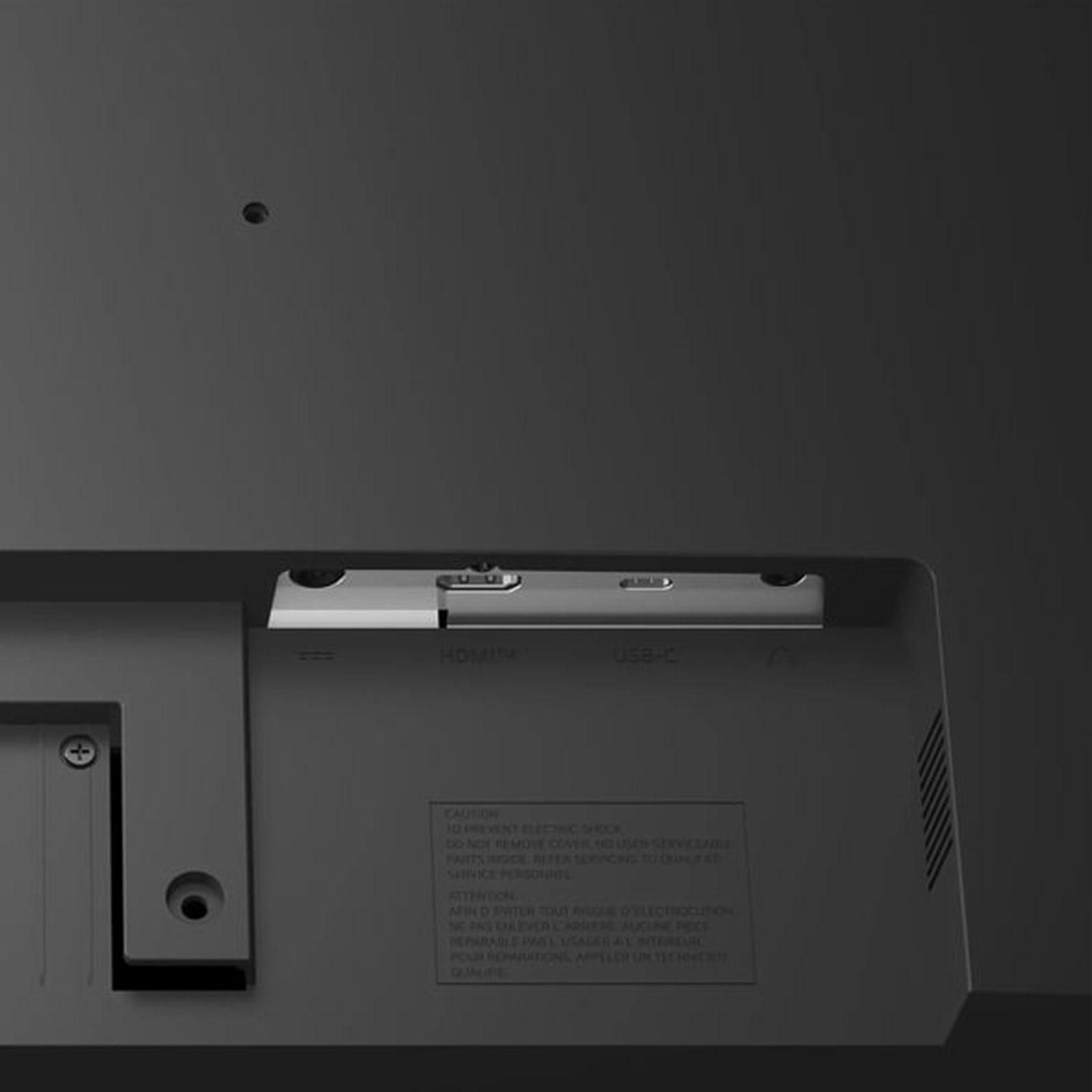 Zbliżenie na tył szarego monitora z portami HDMI i USB-C.