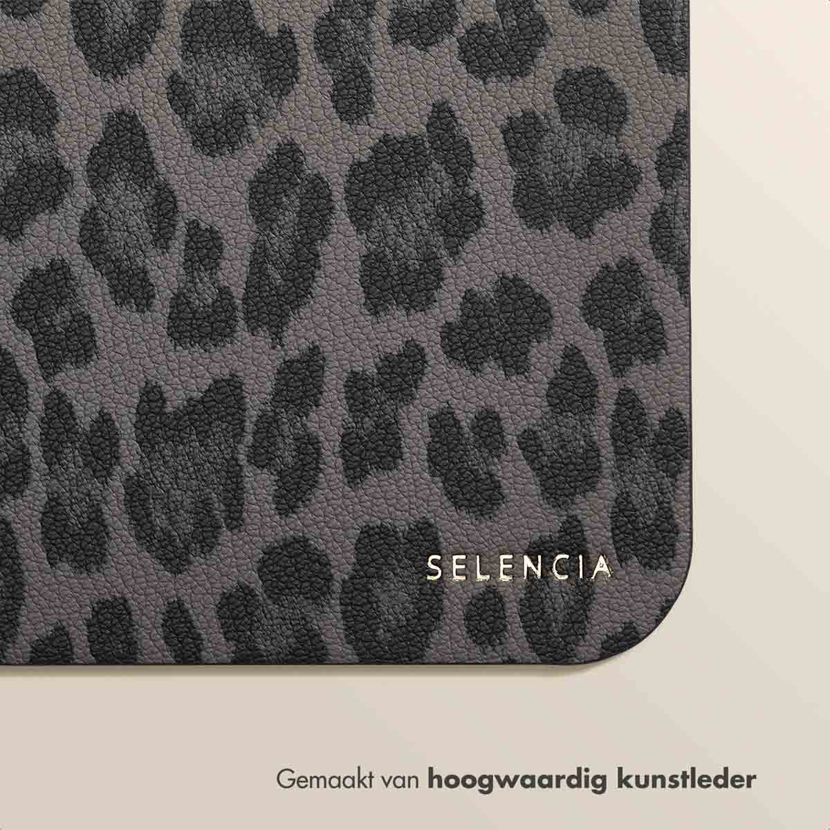 A close-up of a grey leopard print mousepad with the brand name "Selencia" in gold lettering.
