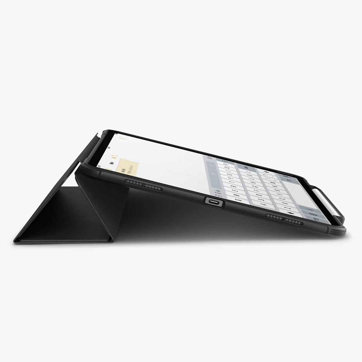 A tablet in a black case is propped up, displaying a keyboard on its screen.