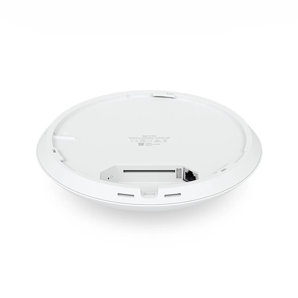 The back side of a white round device with a port and a label on a white background.