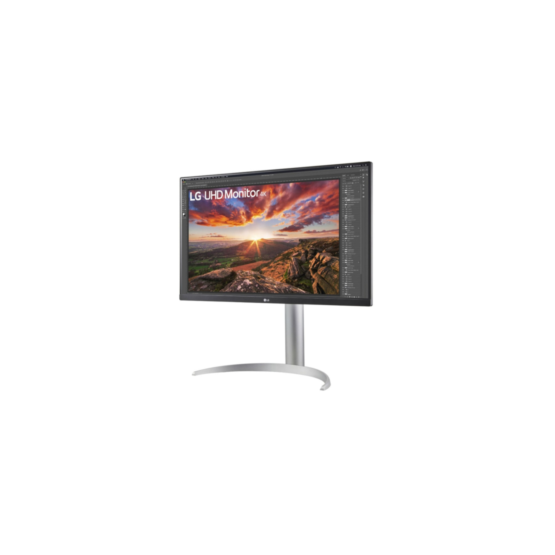 Monitor LG UHD z obrazem zachodu słońca na ekranie, izolowany na białym tle.