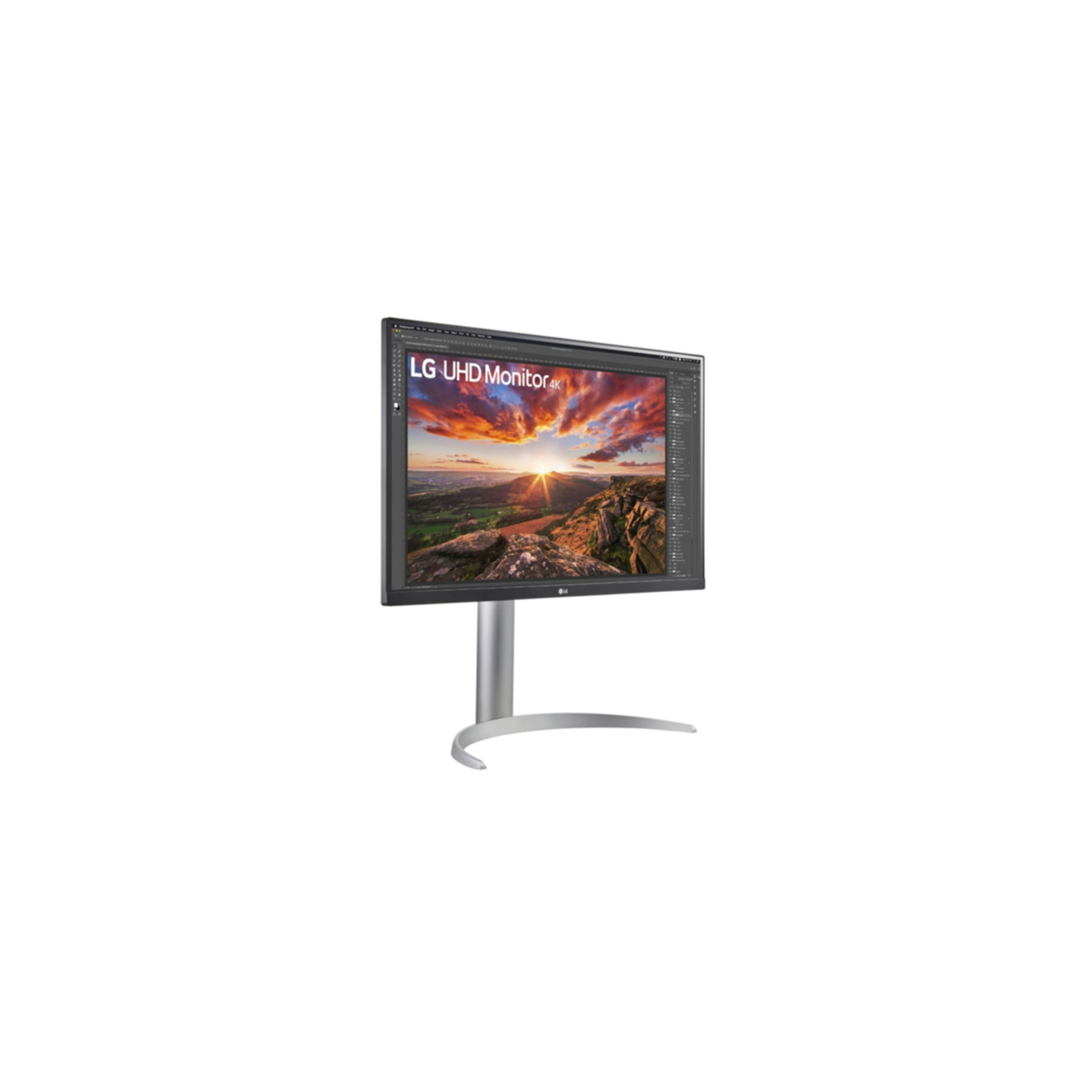 Monitor LG UHD 4K z obrazem zachodu słońca na ekranie, ustawiony pod kątem na białym tle.