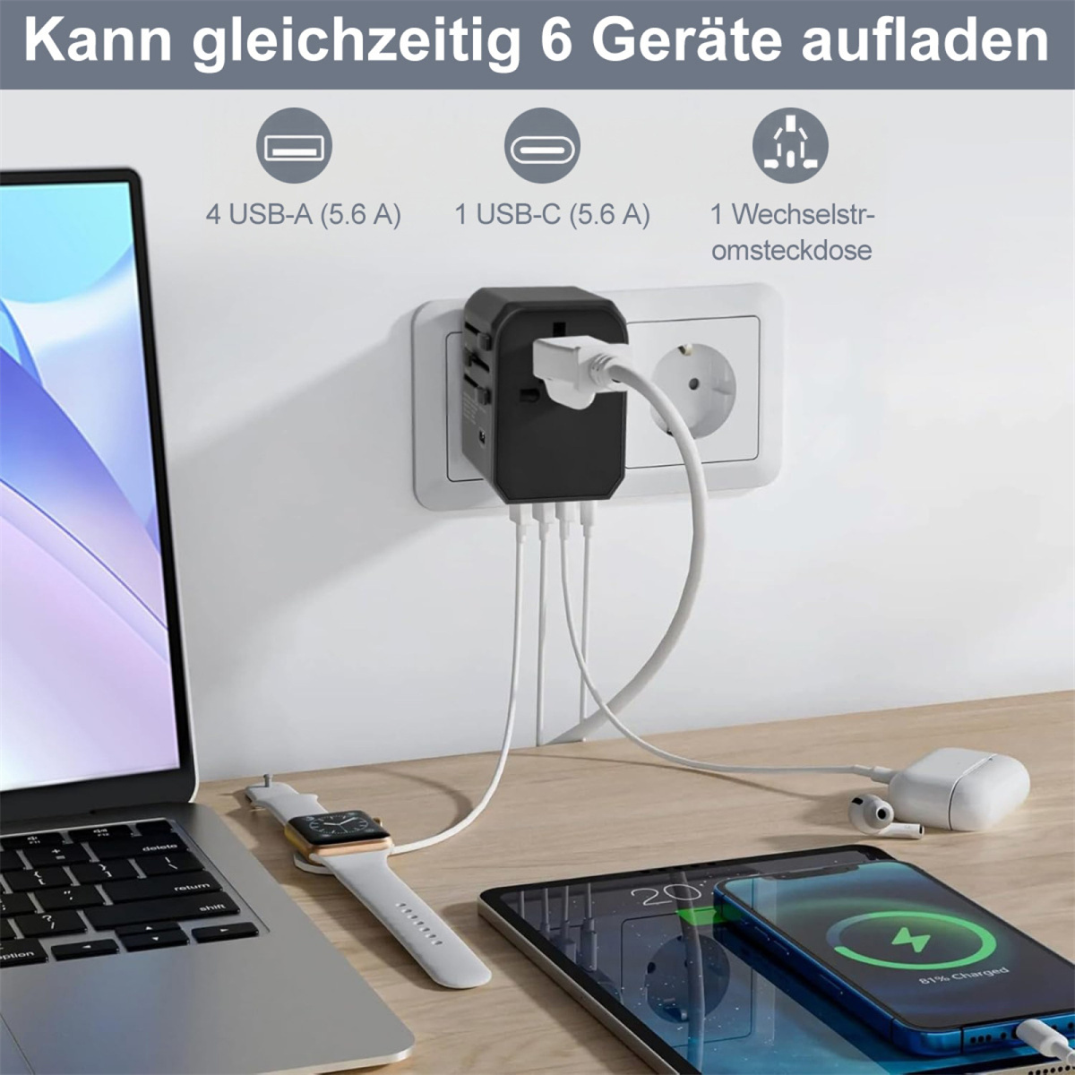 Ein schwarzer Reiseadapter wird in eine weiße Steckdose gesteckt und lädt Geräte wie einen Laptop, eine Uhr, ein Telefon und Ohrhörer auf.