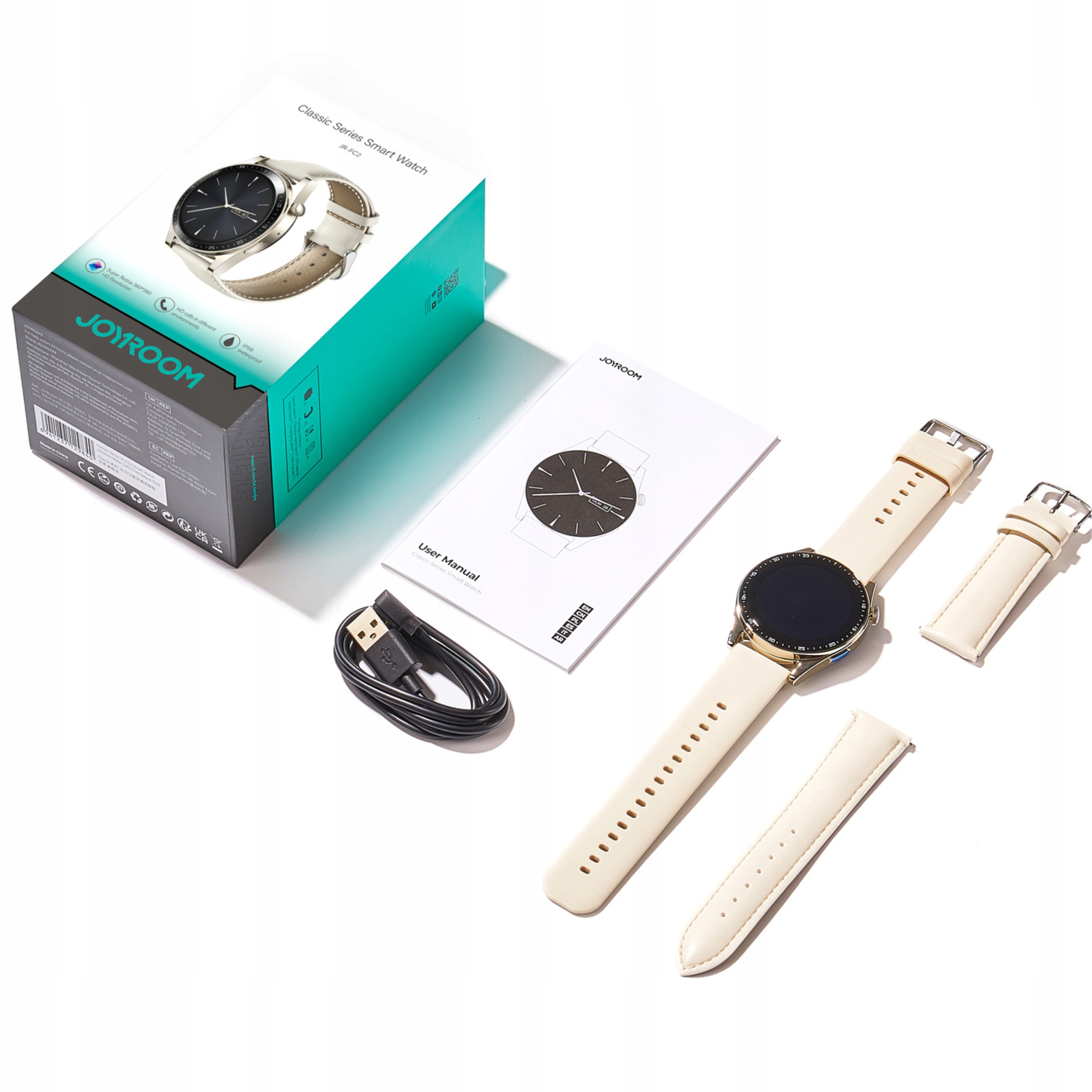 Eine Smartwatch, Box, Ladegerät, Handbuch und ein zusätzliches Armband sind auf einer weißen Oberfläche angeordnet.