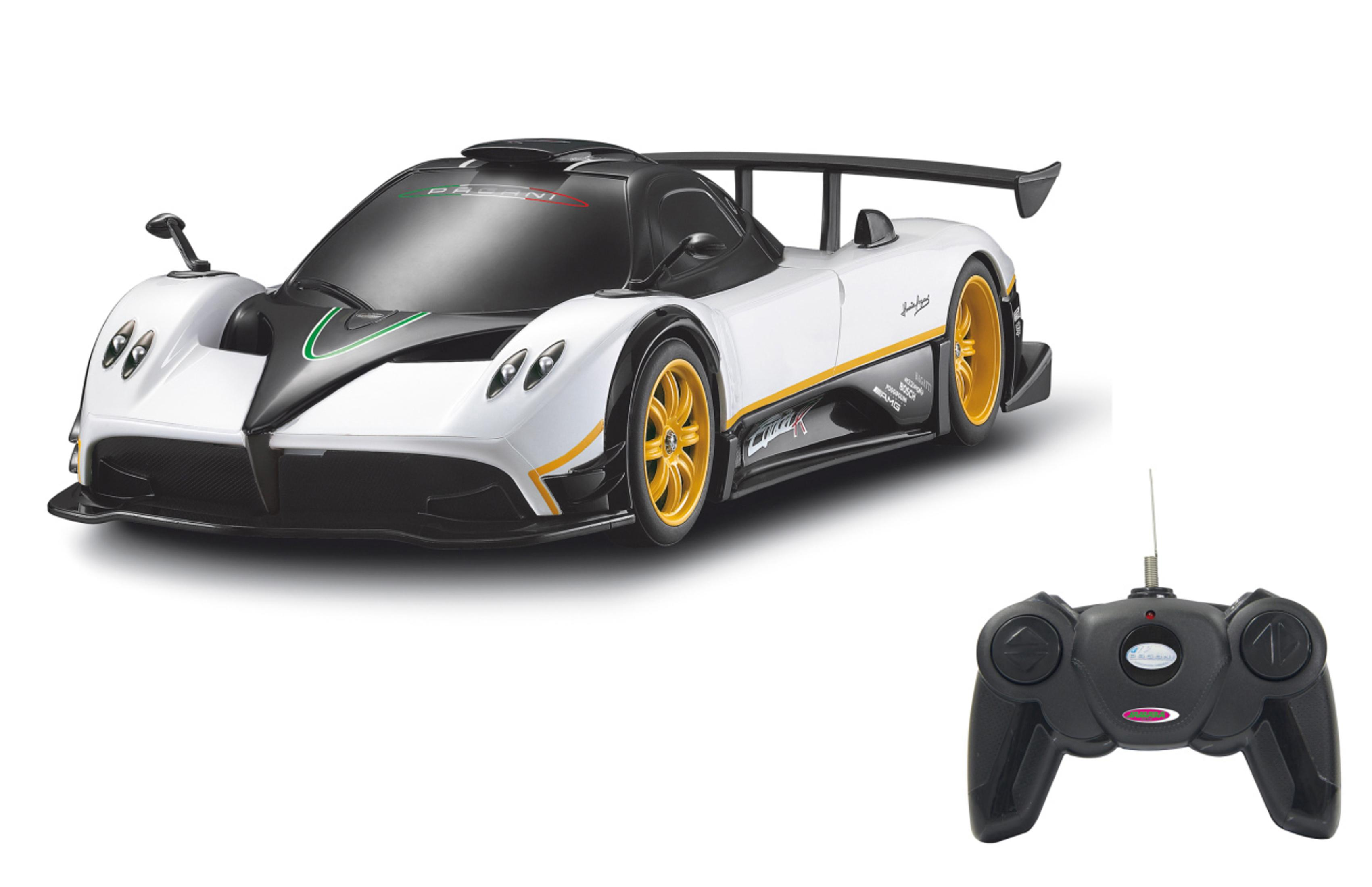Ein weißes Pagani Zonda R Spielzeugauto mit gelben Rädern und einer schwarzen Fernbedienung.