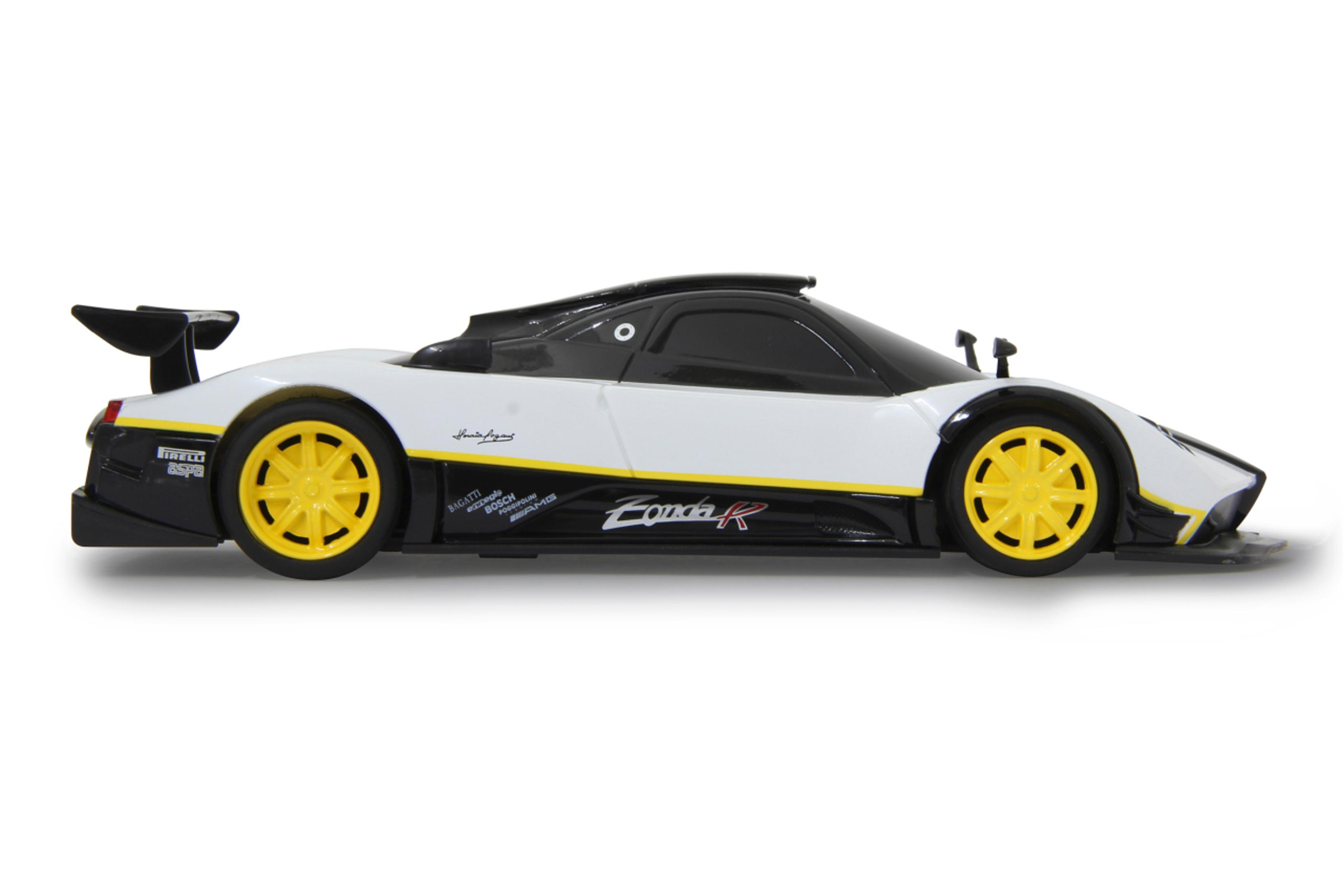 Seitenansicht eines weißen und schwarzen Pagani Zonda R Spielzeugautos mit gelben Rädern.