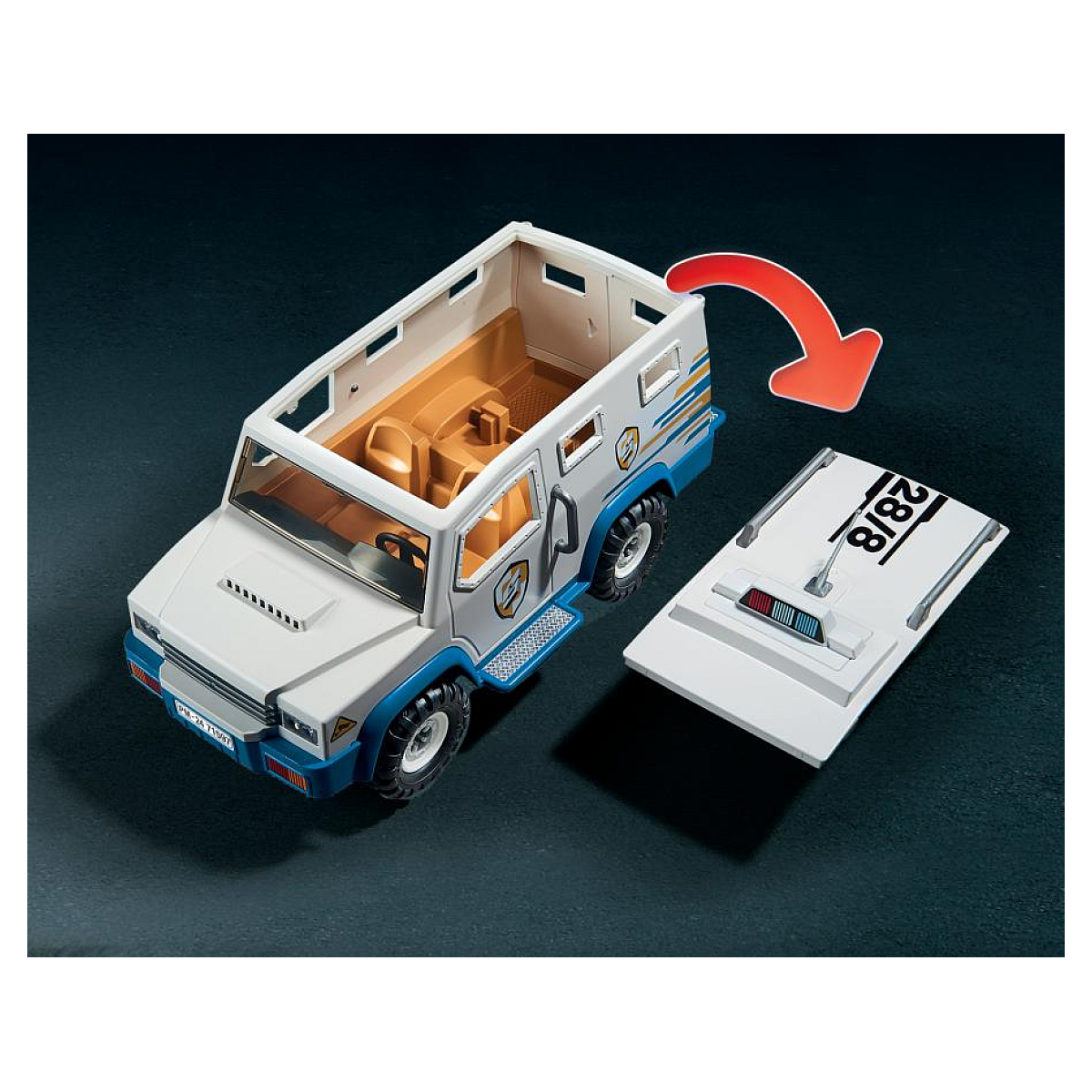 Camion blindato Playmobil con tetto aperto e pezzo di tetto separato. Freccia rossa indica l'apertura.