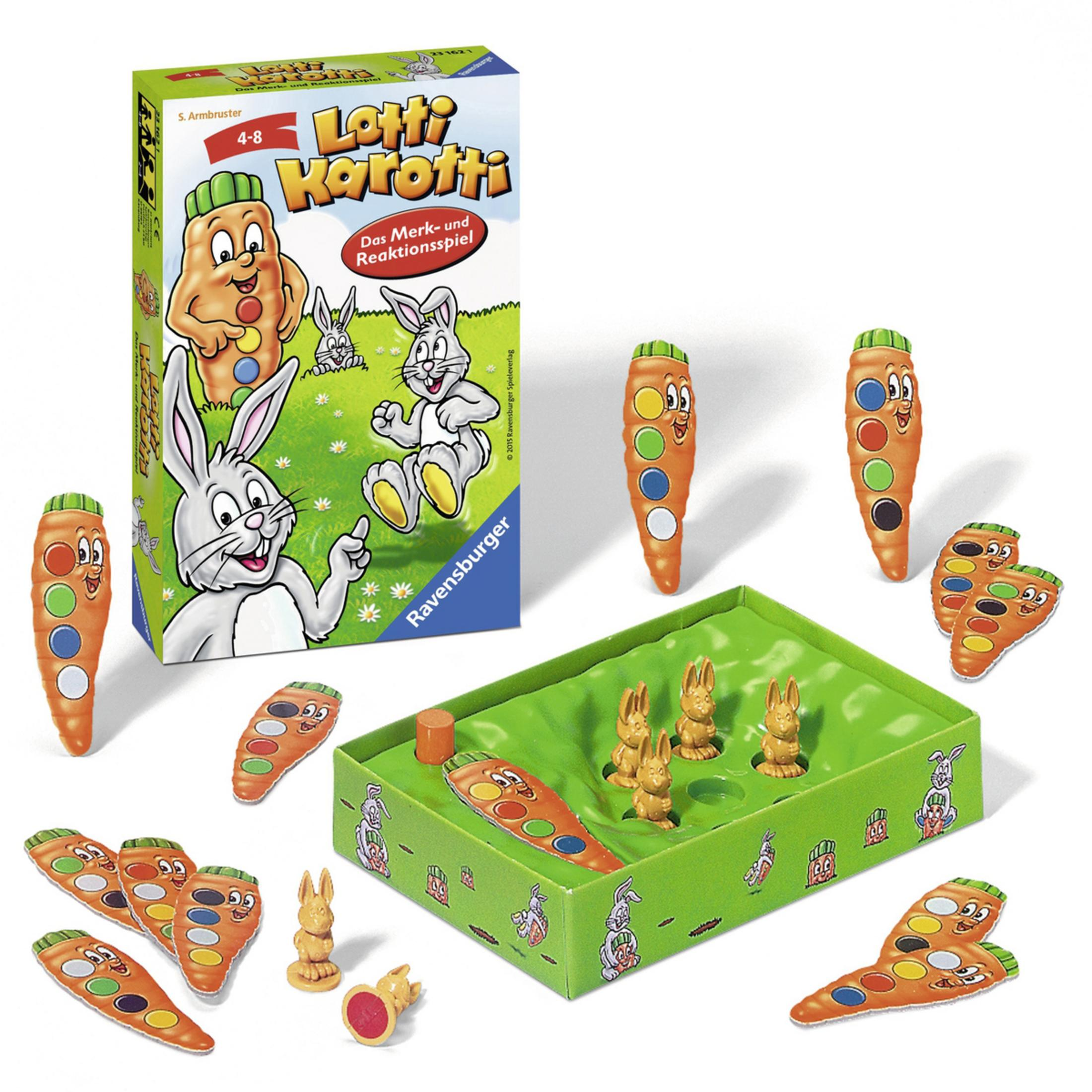 Lotti Karotti Spiel mit Schachtel, Karotten und Hasen. Spielsteine sind sichtbar. Das Spiel ist aufgebaut.