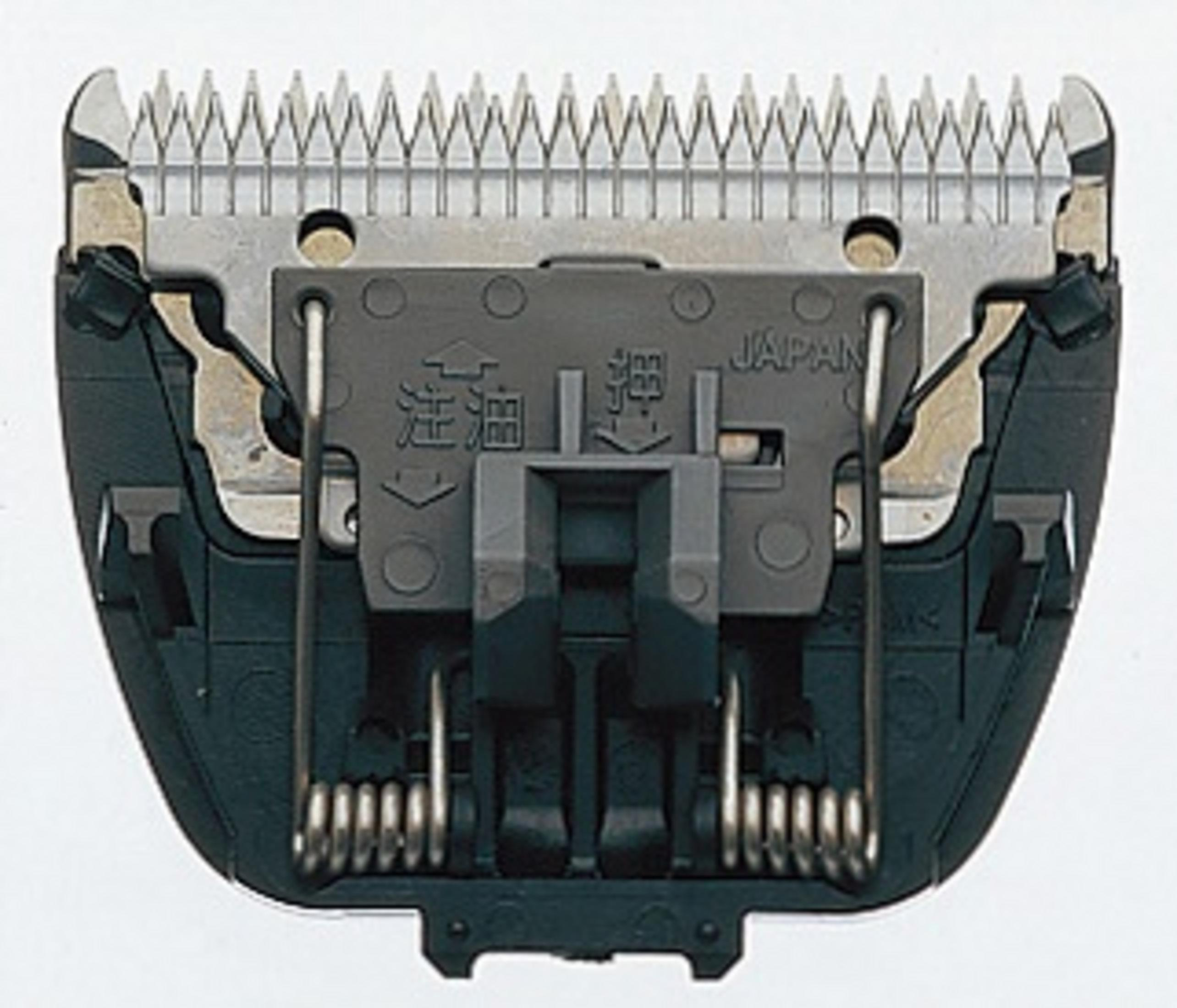 Eine Nahaufnahme eines schwarzen und silbernen Elektrorasiererkopfes mit japanischem Text darauf.