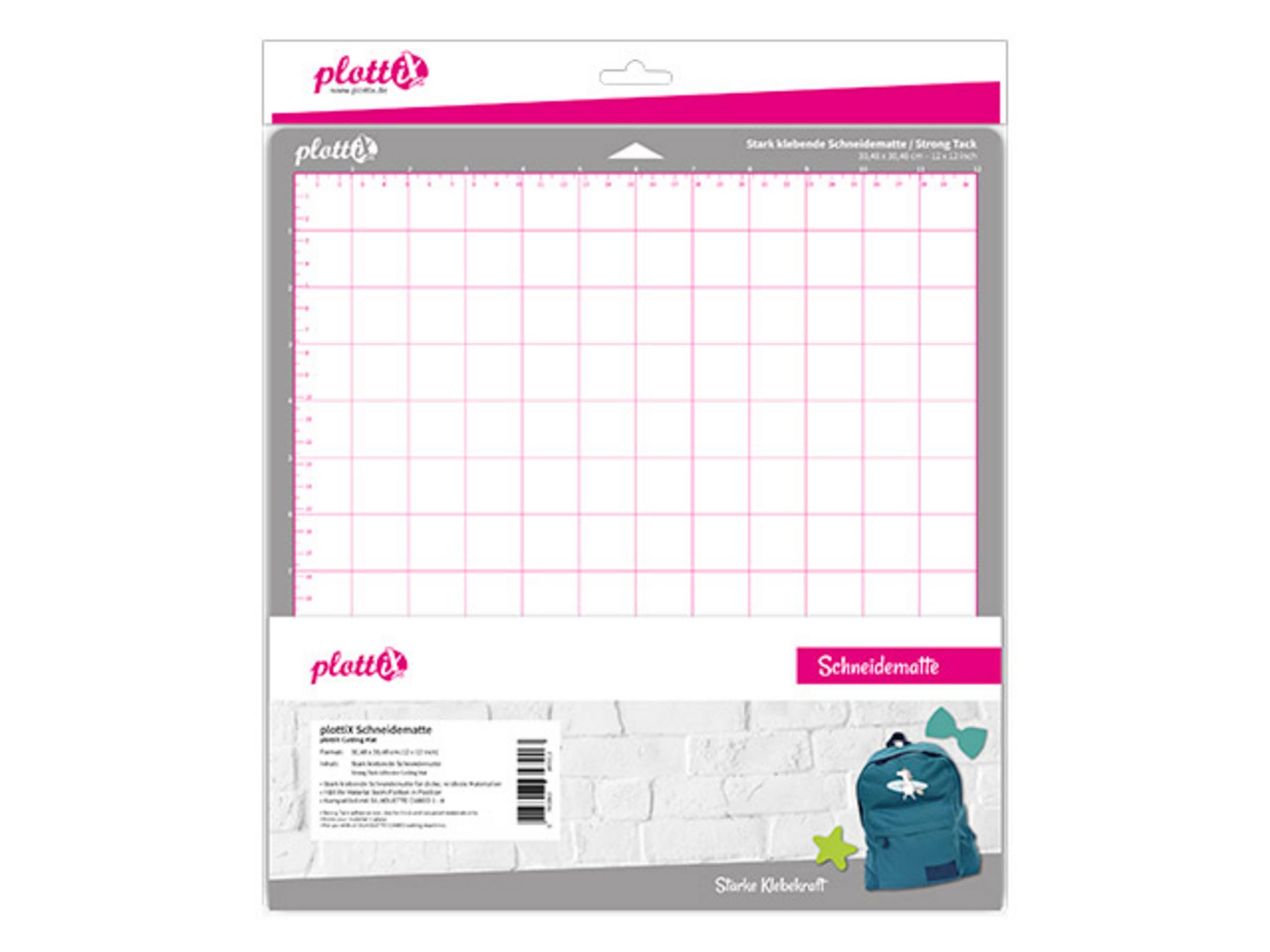 Schneidematte in Verpackung mit Gitter, Text und Cartoon-Rucksack.