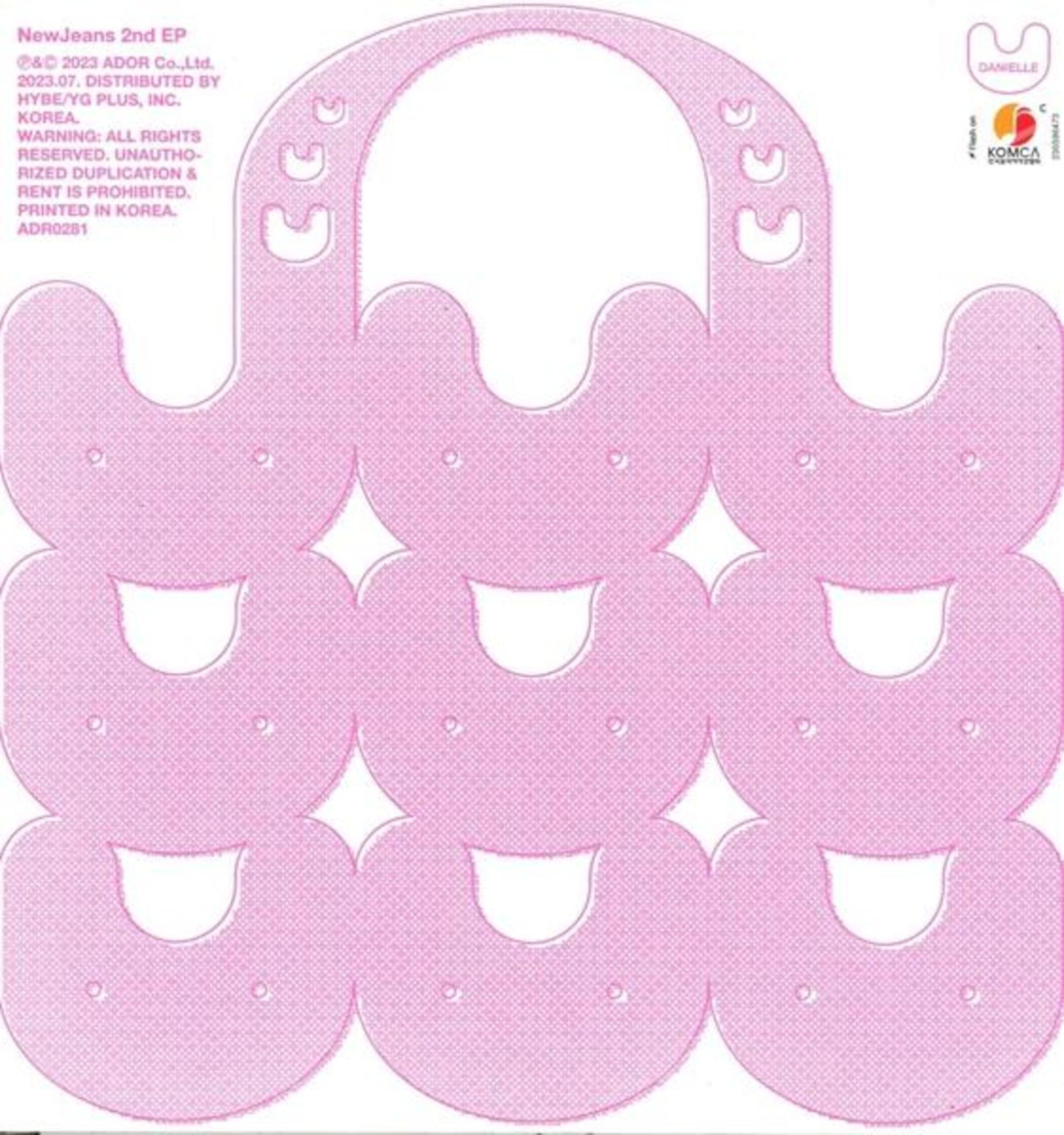 Un design di carta fustellata rosa con forme ripetute, probabilmente per imballaggi o un elemento decorativo.