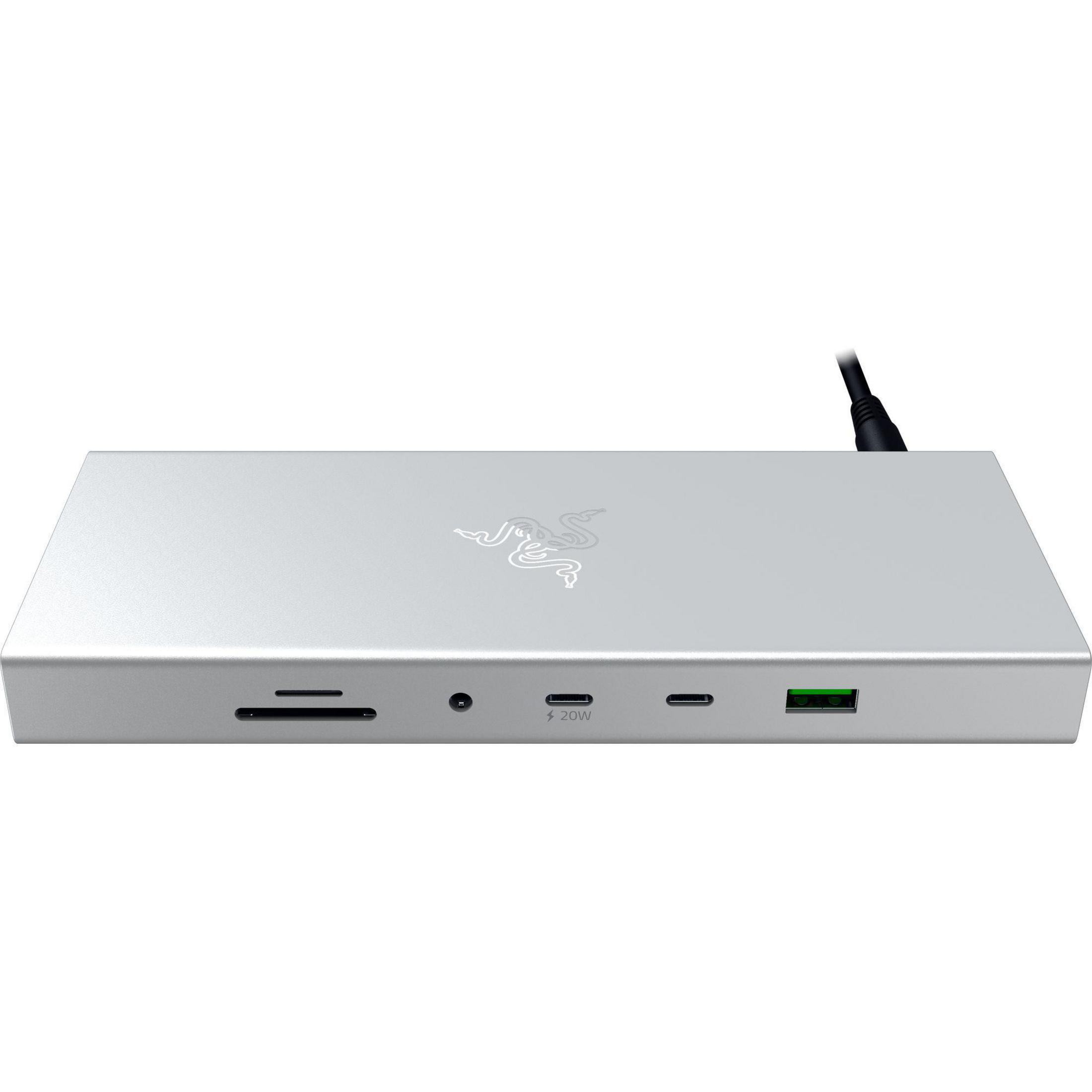 Silberne Dockingstation mit mehreren Anschlüssen, darunter USB, Ethernet und SD-Kartensteckplätze, auf weißem Hintergrund.