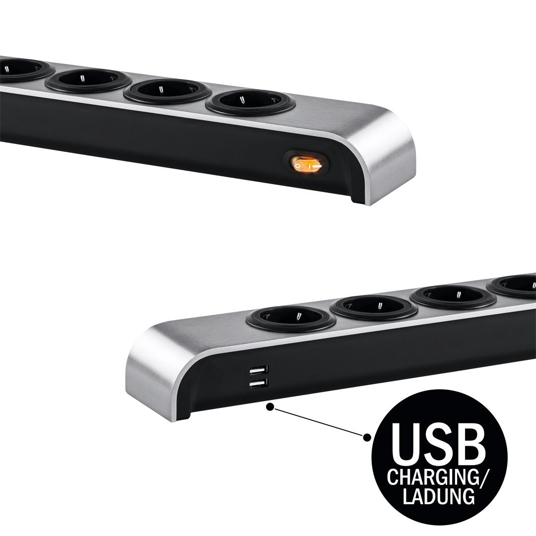 Eine silberne und schwarze Steckdosenleiste verfügt über fünf Steckdosen, zwei USB-Anschlüsse und ein USB-Ladesymbol.