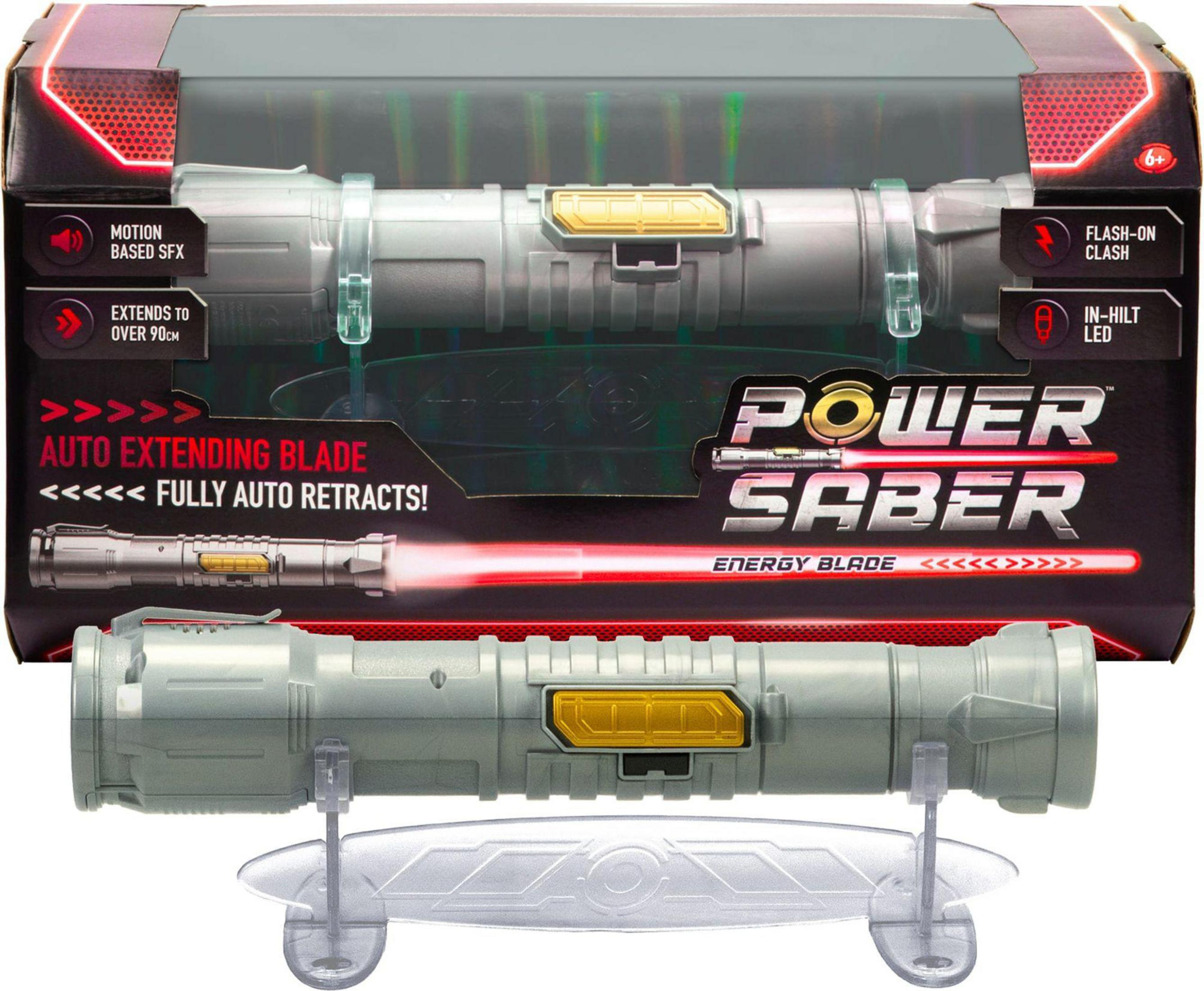 Spada laser giocattolo Power Saber, lama estesa. Confezione sullo sfondo. Mostra la lama auto-estendibile.