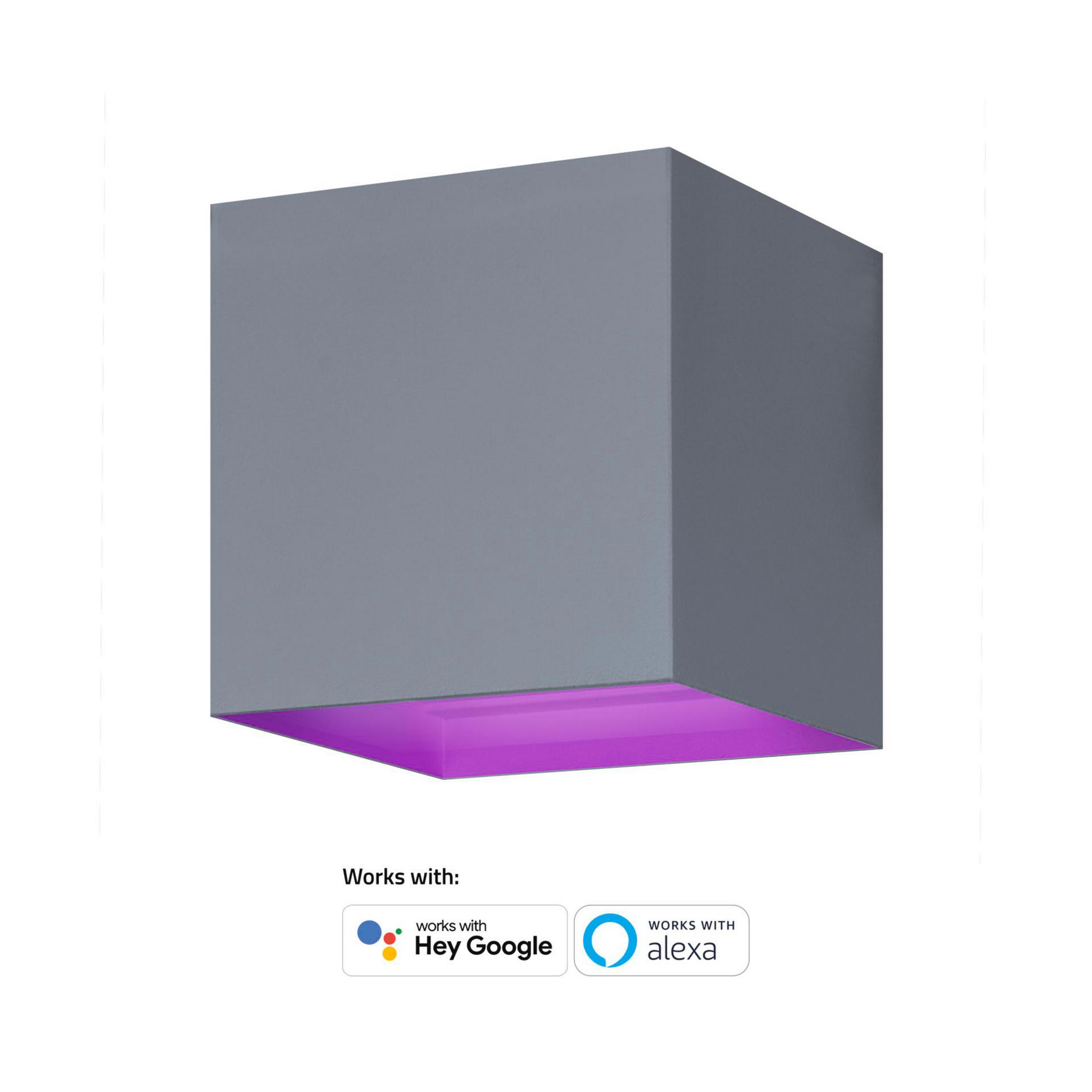 Une applique murale cubique grise émettant une lueur violette, étiquetée comme compatible avec Google et Alexa.