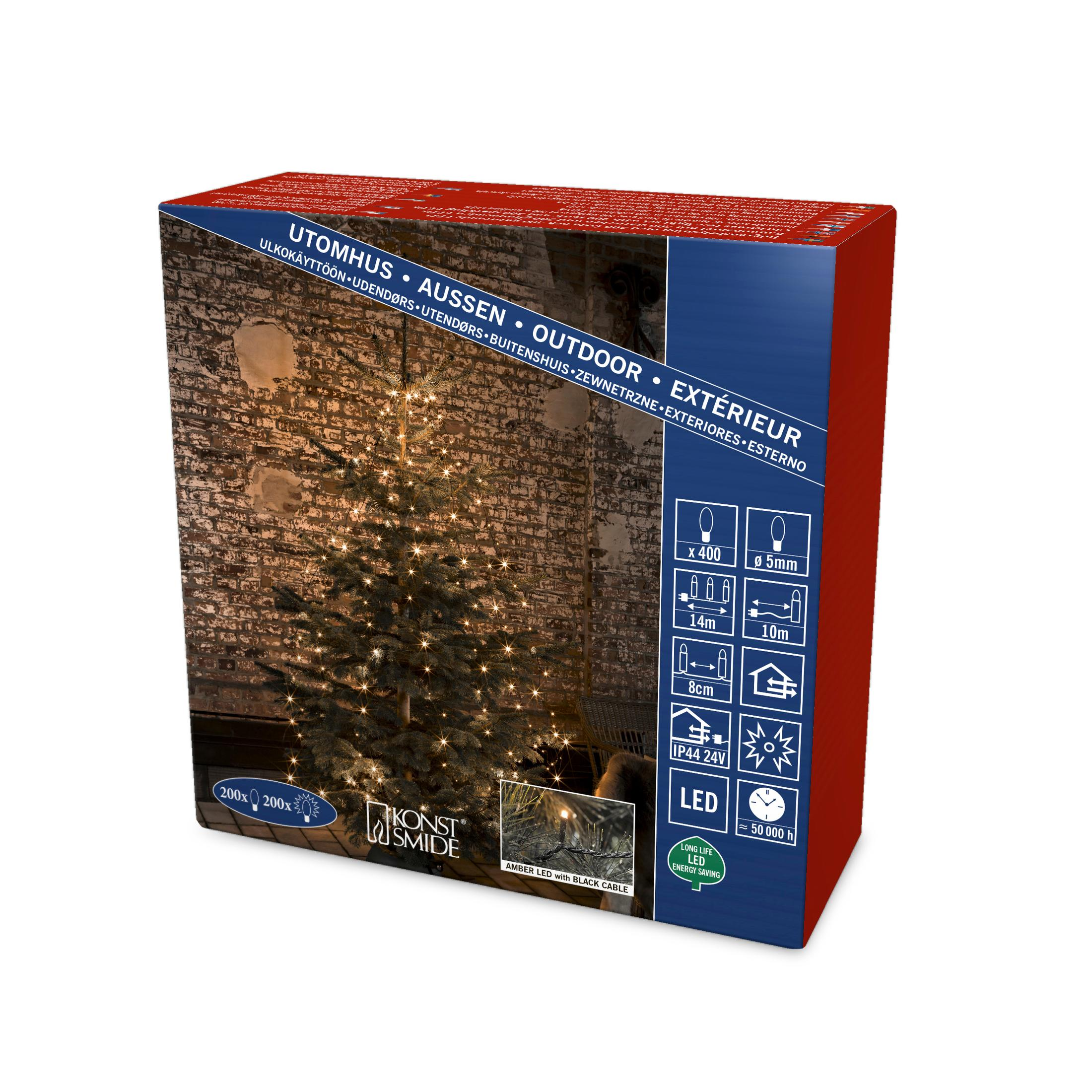 Eine Box mit einem Weihnachtsbaum mit Lichtern und Text in mehreren Sprachen. Der Baum hat einen Hintergrund aus Ziegelmauerwerk.