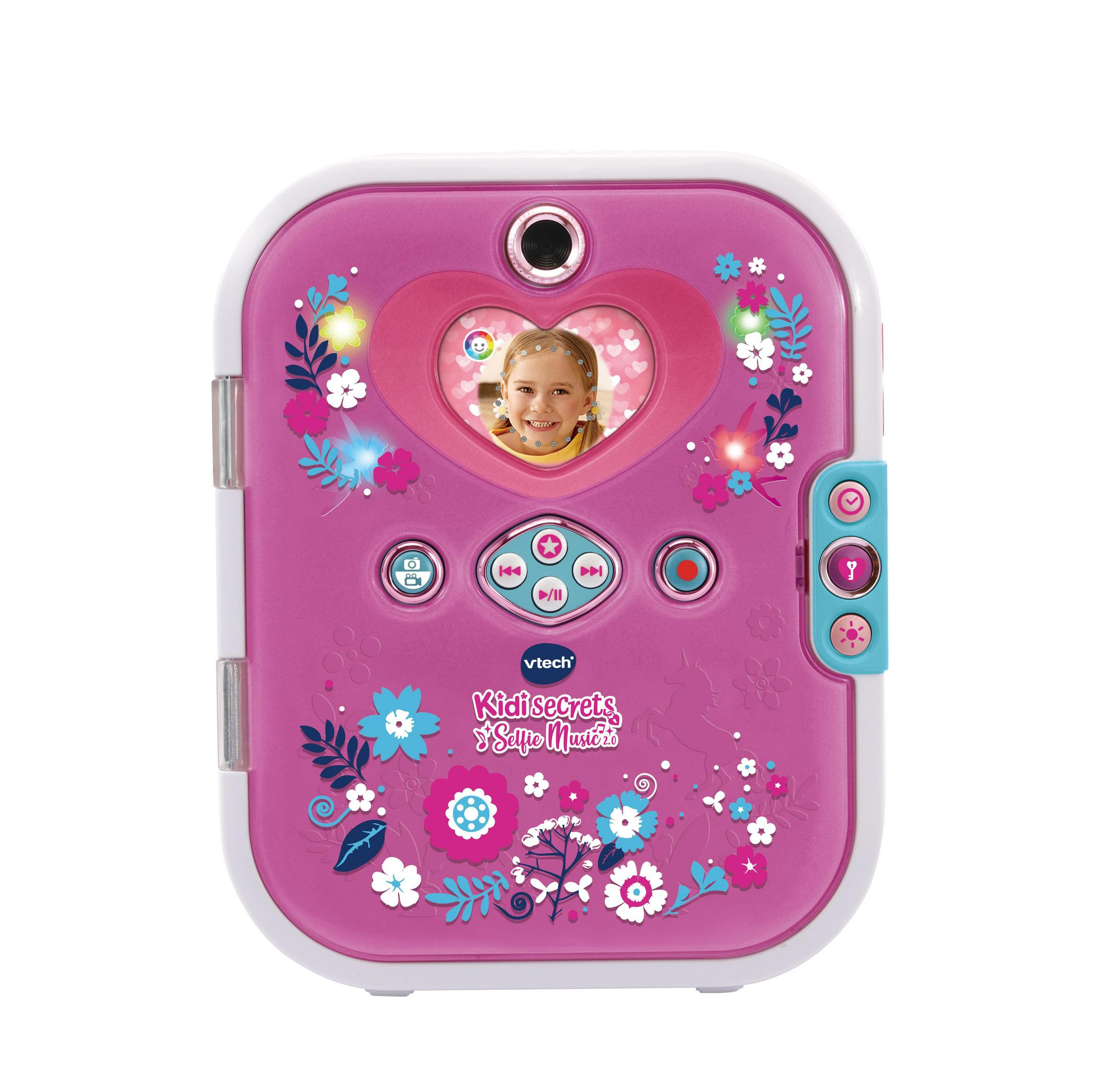 Rosa-weißes VTech Kidisecrets Selfie Musik-Tagebuch mit floralen Mustern und einem Bildschirm, der das Gesicht eines Kindes zeigt.