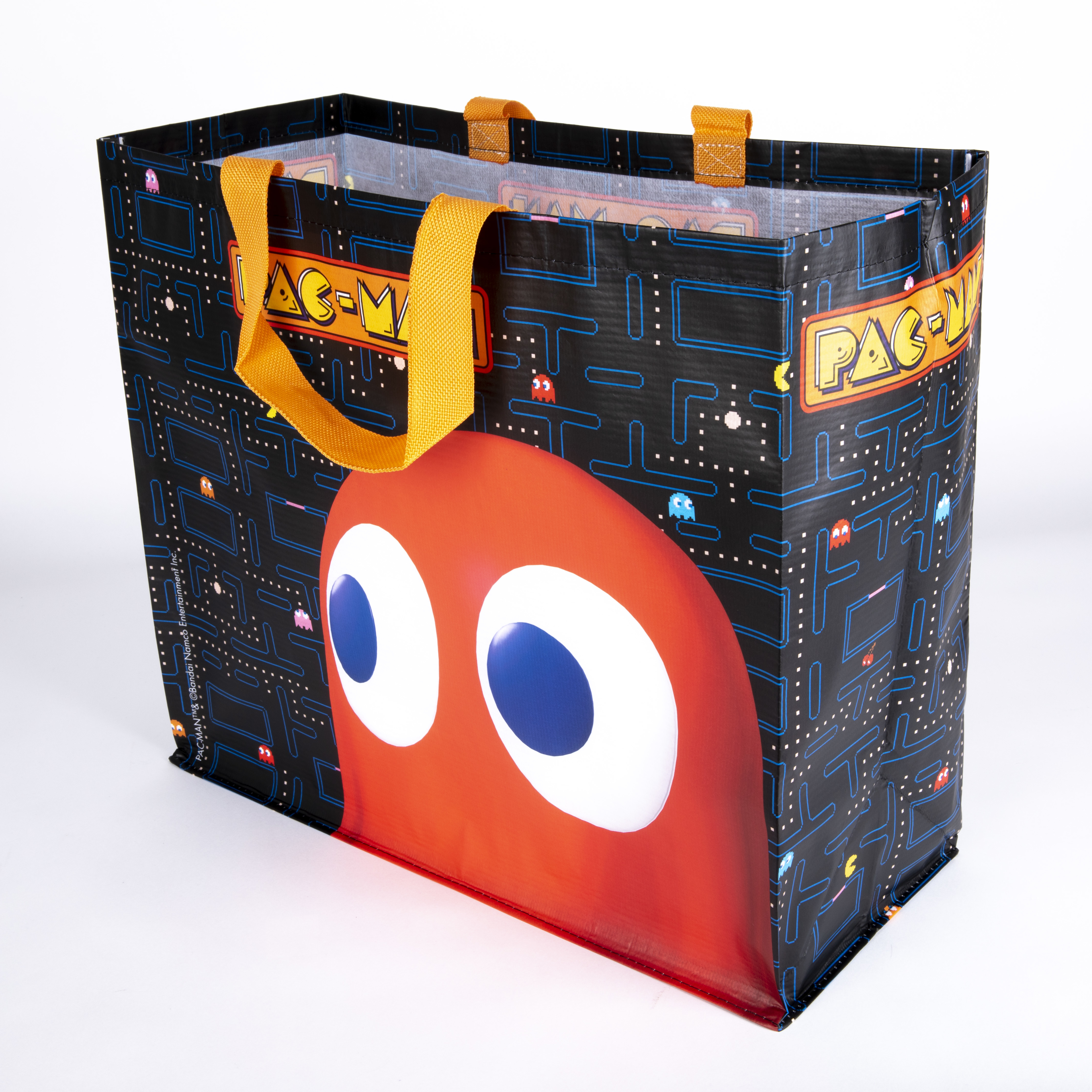 Eine Pac-Man-Einkaufstasche mit einem großen Pac-Man auf der Vorderseite und einem Pac-Man-Labyrinth-Muster.