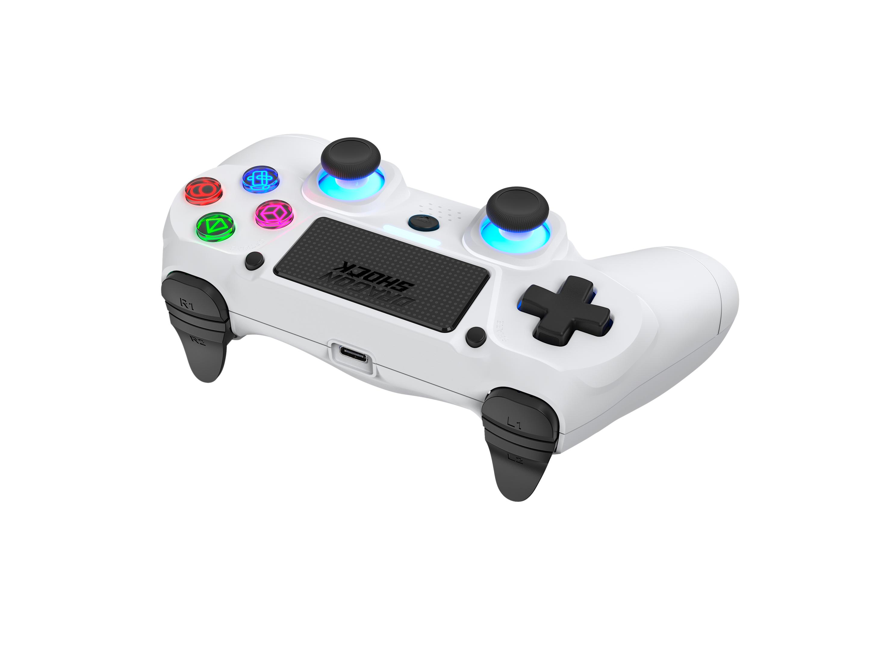 Weißes Dragon Shock Gamepad mit bunten Knöpfen. Schwarzes Kreuz und linker Stick vorne.