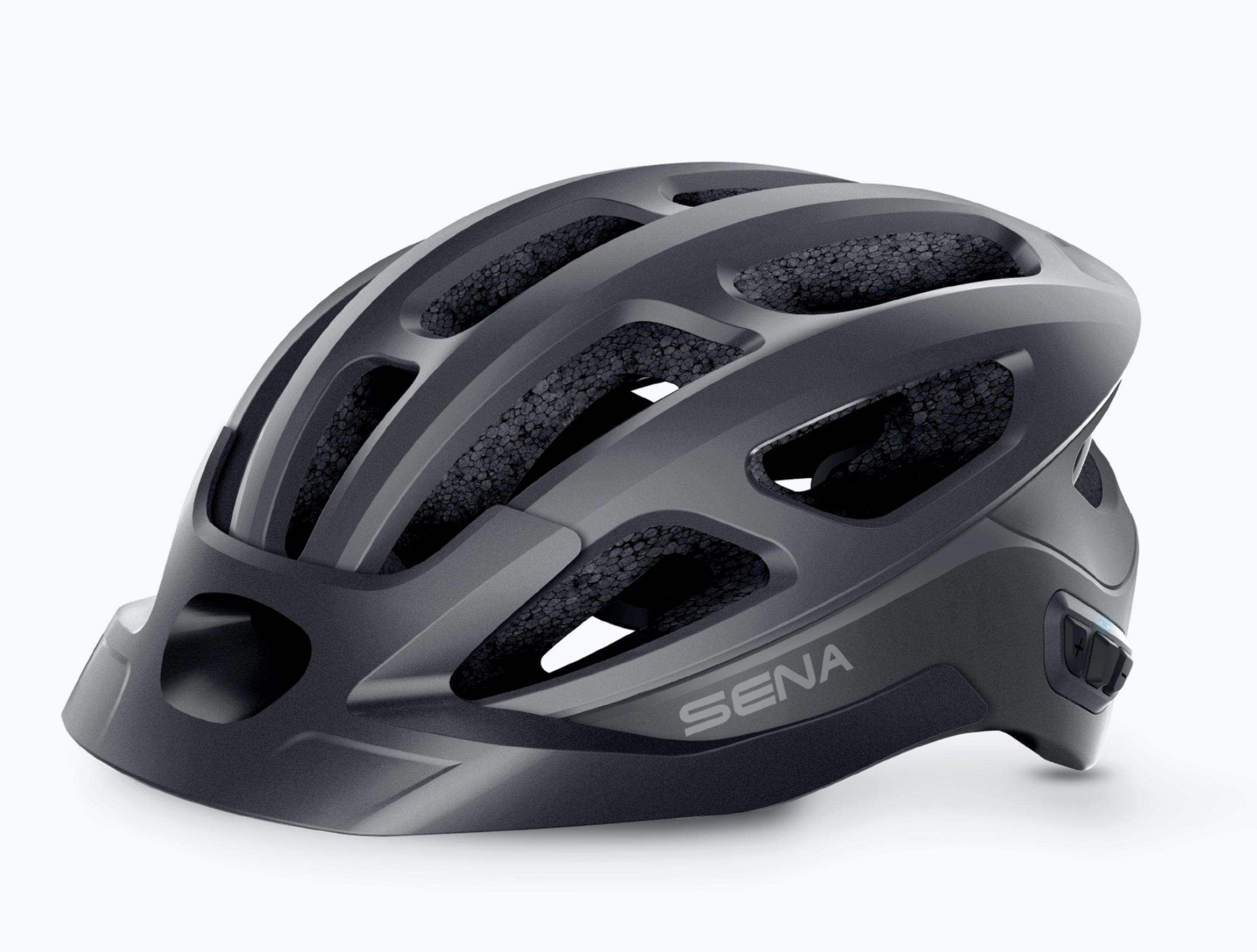 Ein dunkelgrauer Fahrradhelm mit dem Wort SENA auf der Vorderseite. Eine Seitenansicht des Helms.
