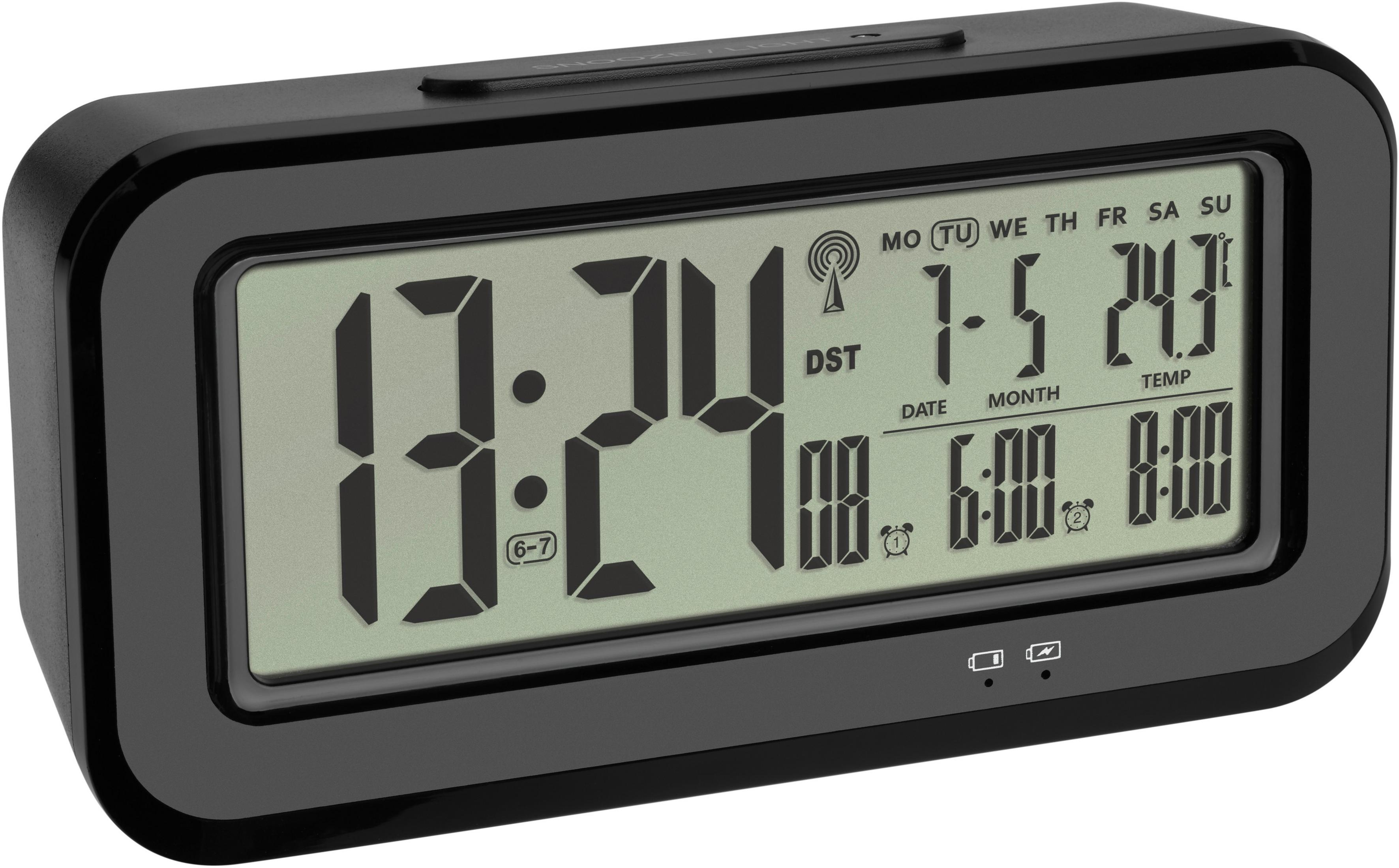 Schwarze Digitaluhr zeigt 13:24, Datum und Weckzeiten an. Zeigt DST und ein Signal-Symbol.