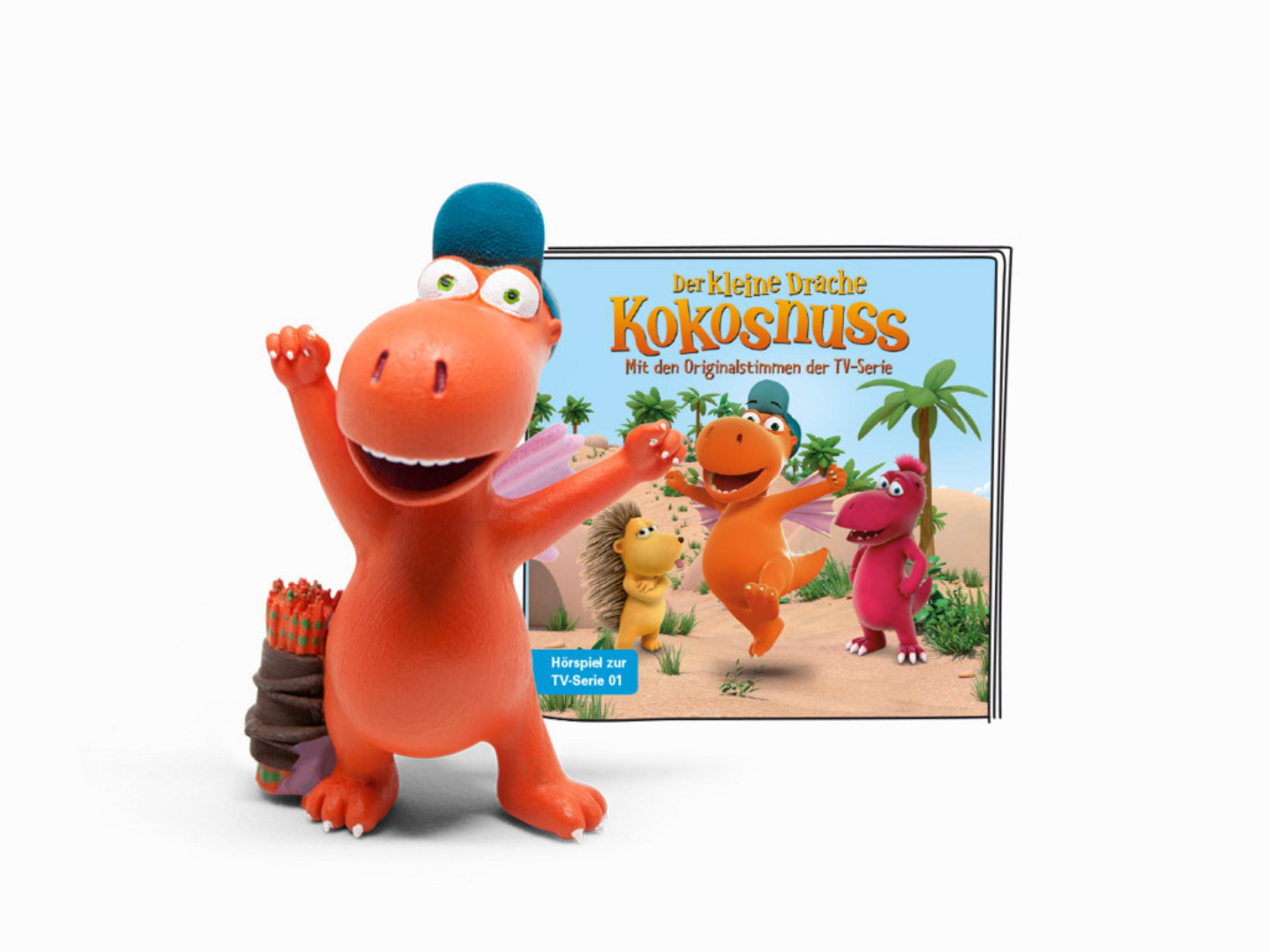 Ein rotes Cartoon-Drachenspielzeug mit einem Buchcover im Hintergrund.