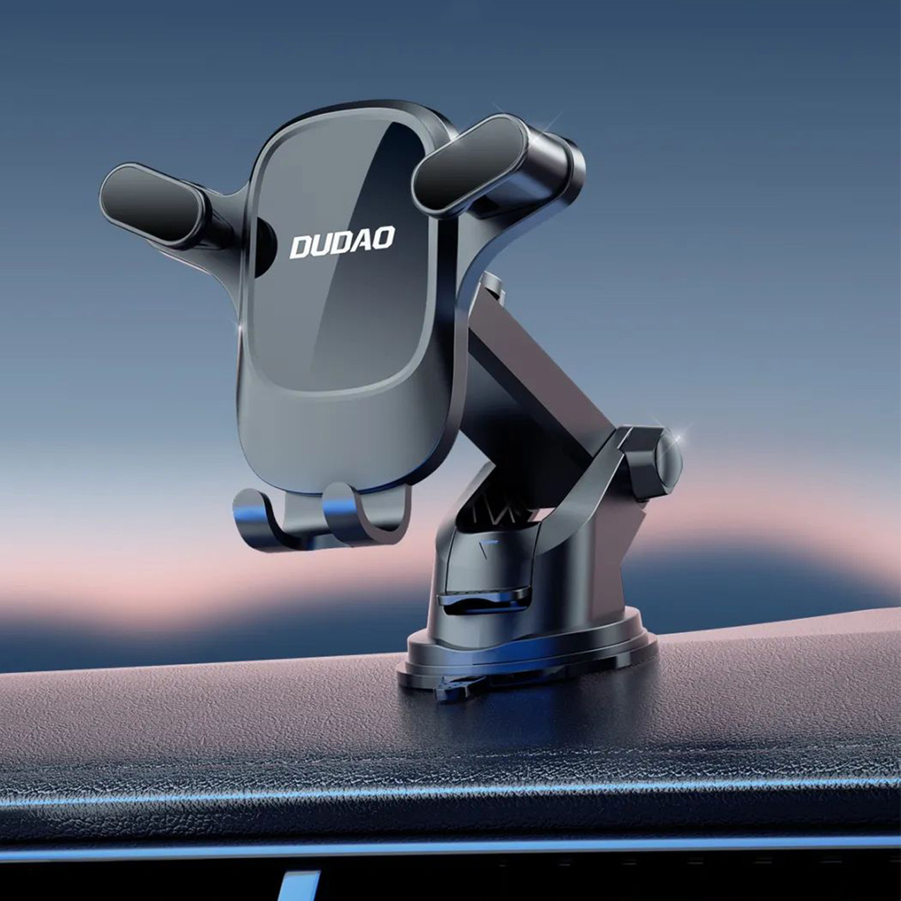 Uchwyt na telefon z napisem "DUDAO" na desce rozdzielczej, na rozmytym tle.