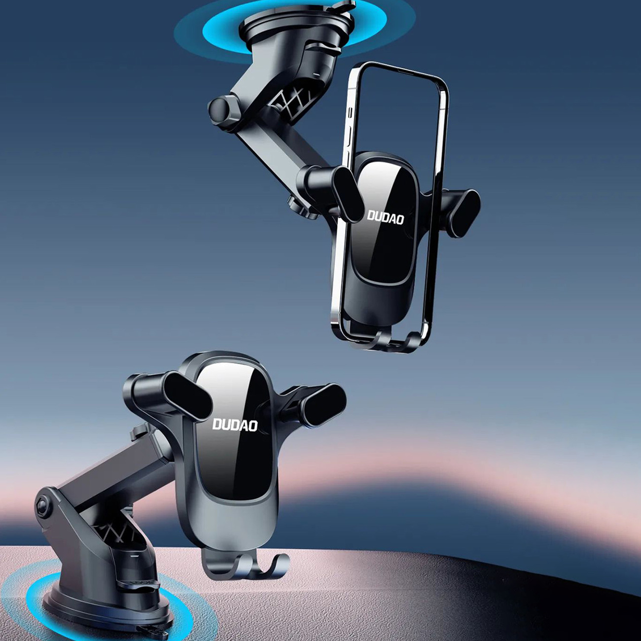 Dwa uchwyty na telefon z "DUDAO", oba zamontowane na przyssawkach.