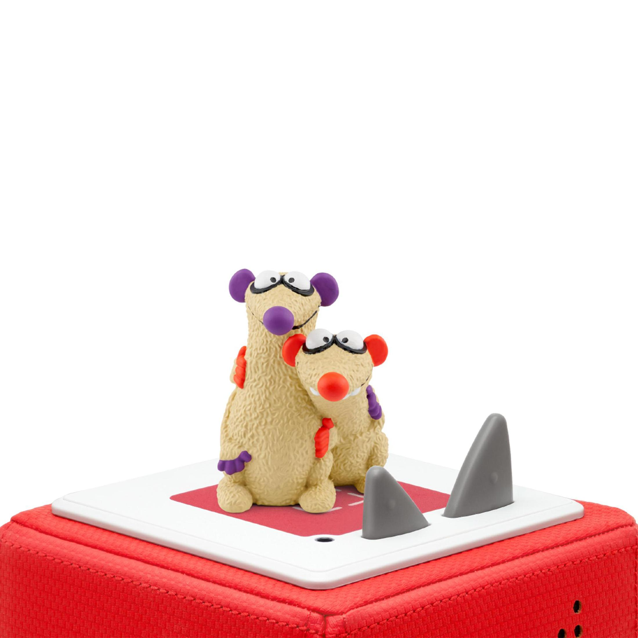 Zwei beige Spielzeugkreaturen mit großen Augen und roten Nasen auf einer rot-weißen Oberfläche mit Haifischflossen.
