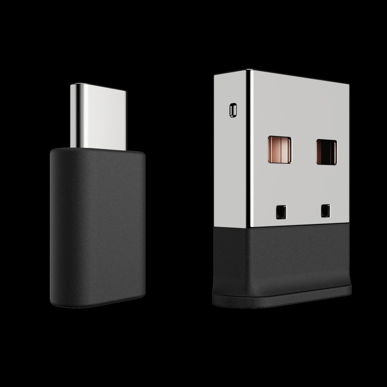 Dwa czarne adaptery USB. Jeden to Type-C, drugi ma metalową górę i czarną podstawę.