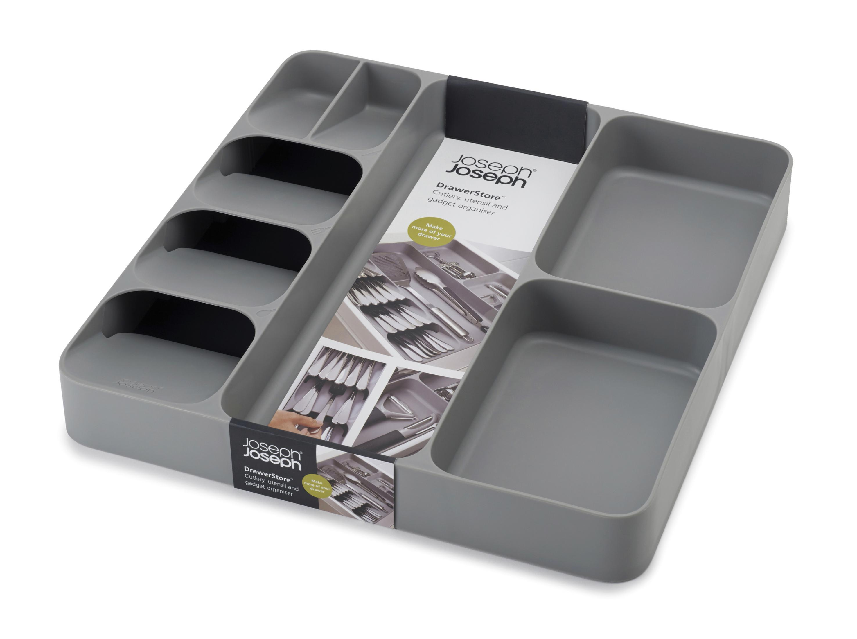 Un organizador de cajones gris con compartimentos. Incluye cubiertos y utensilios. El fondo es blanco.