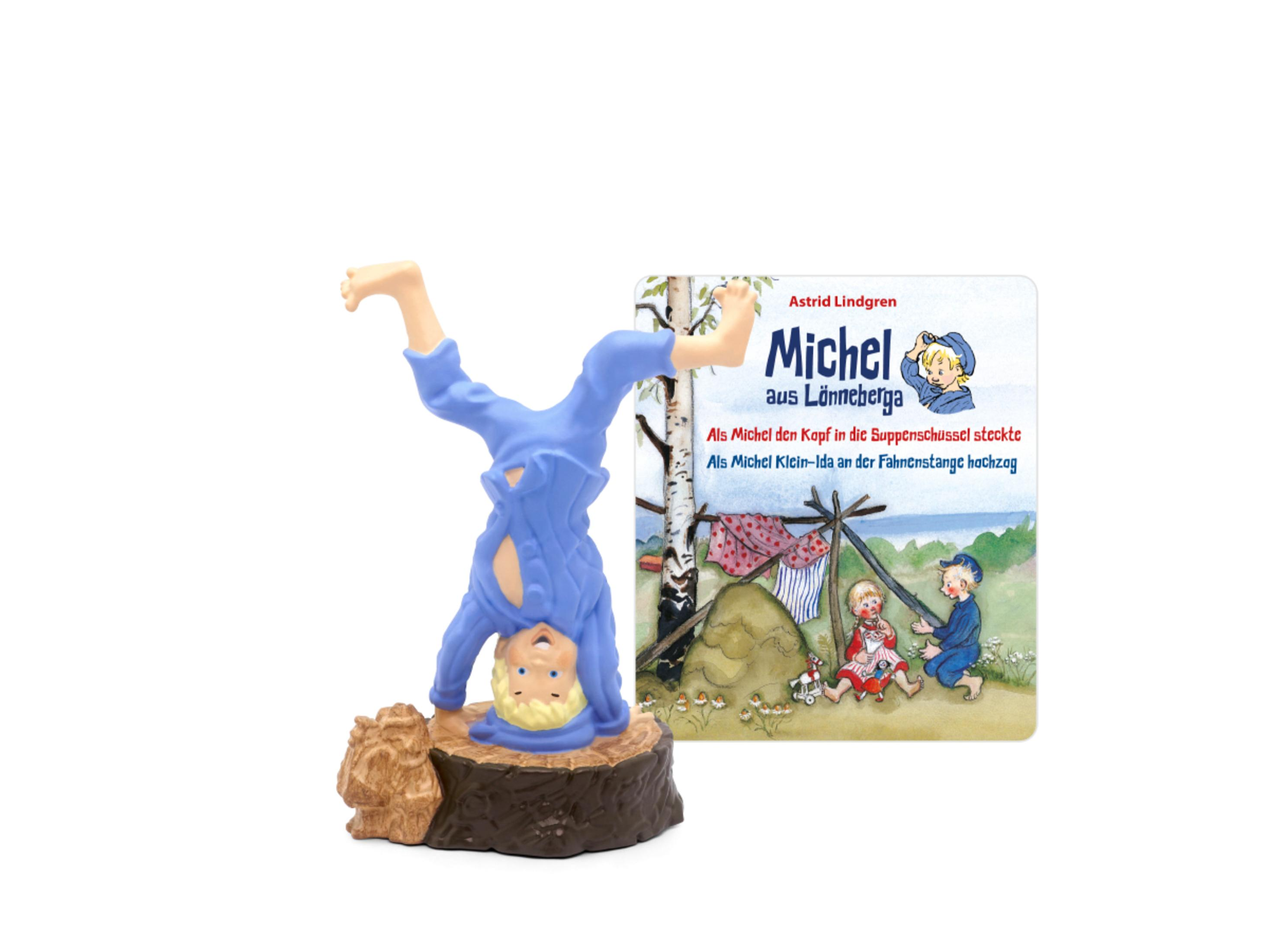 Spielfigur eines Jungen, der einen Handstand macht, mit einem Buch namens 'Michel aus Lönneberga'.