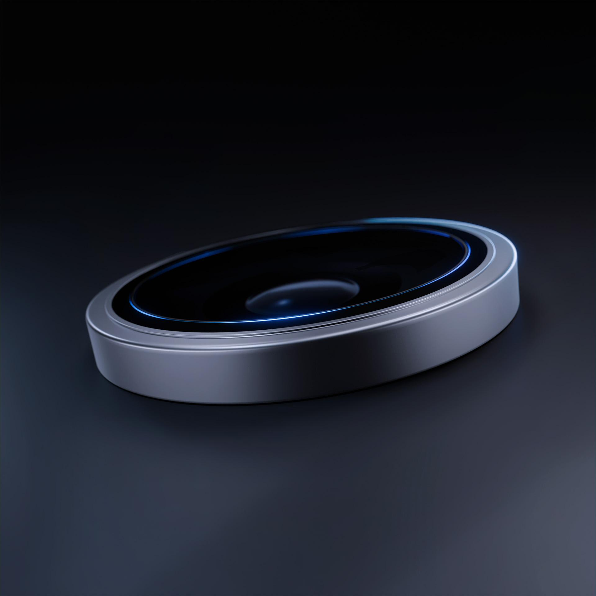 Zbliżenie okrągłego obiektu ze srebrną obwódką i niebieską poświatą.