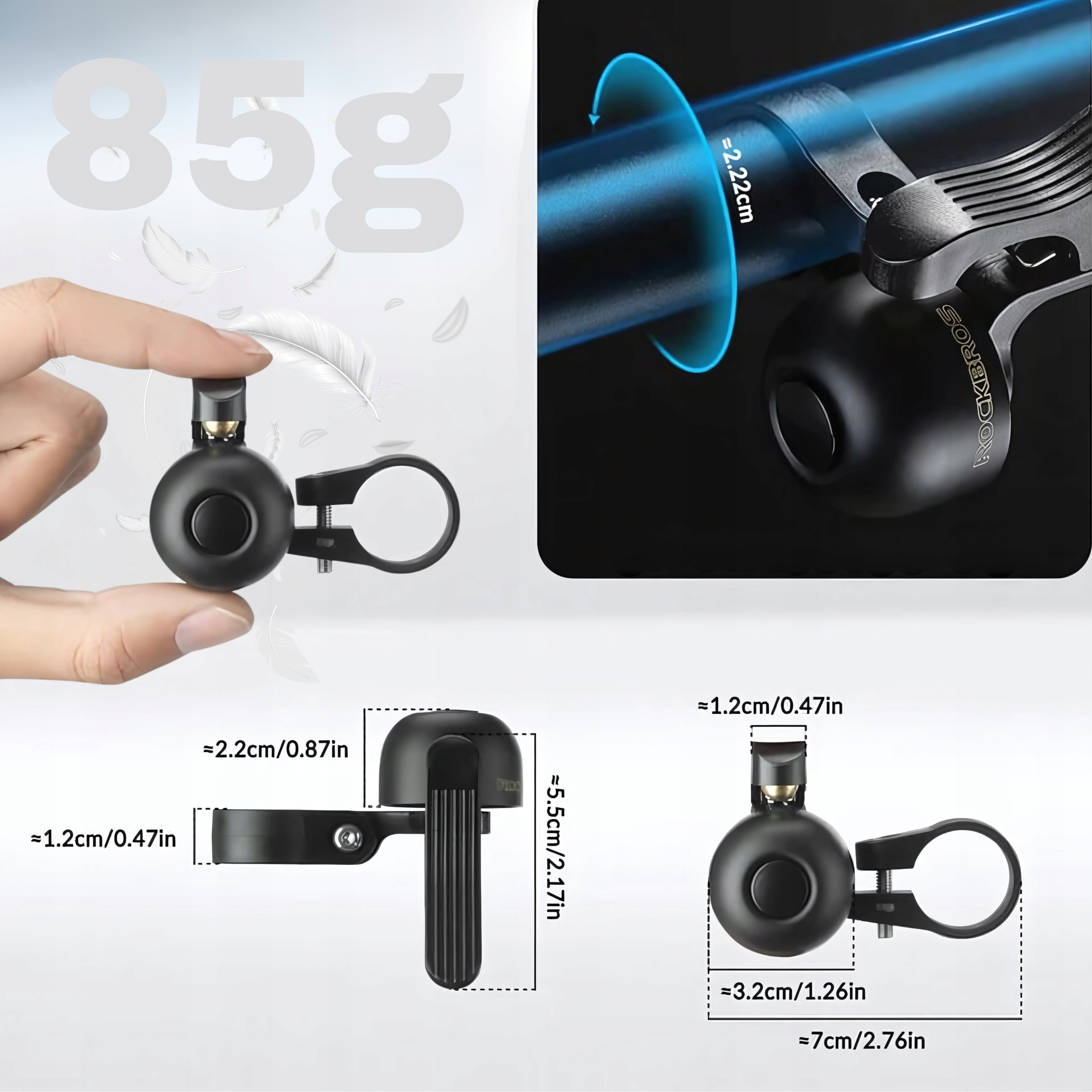 Dzwonek rowerowy z wymiarami i dłoń trzymająca pióro. Dzwonek jest czarny.