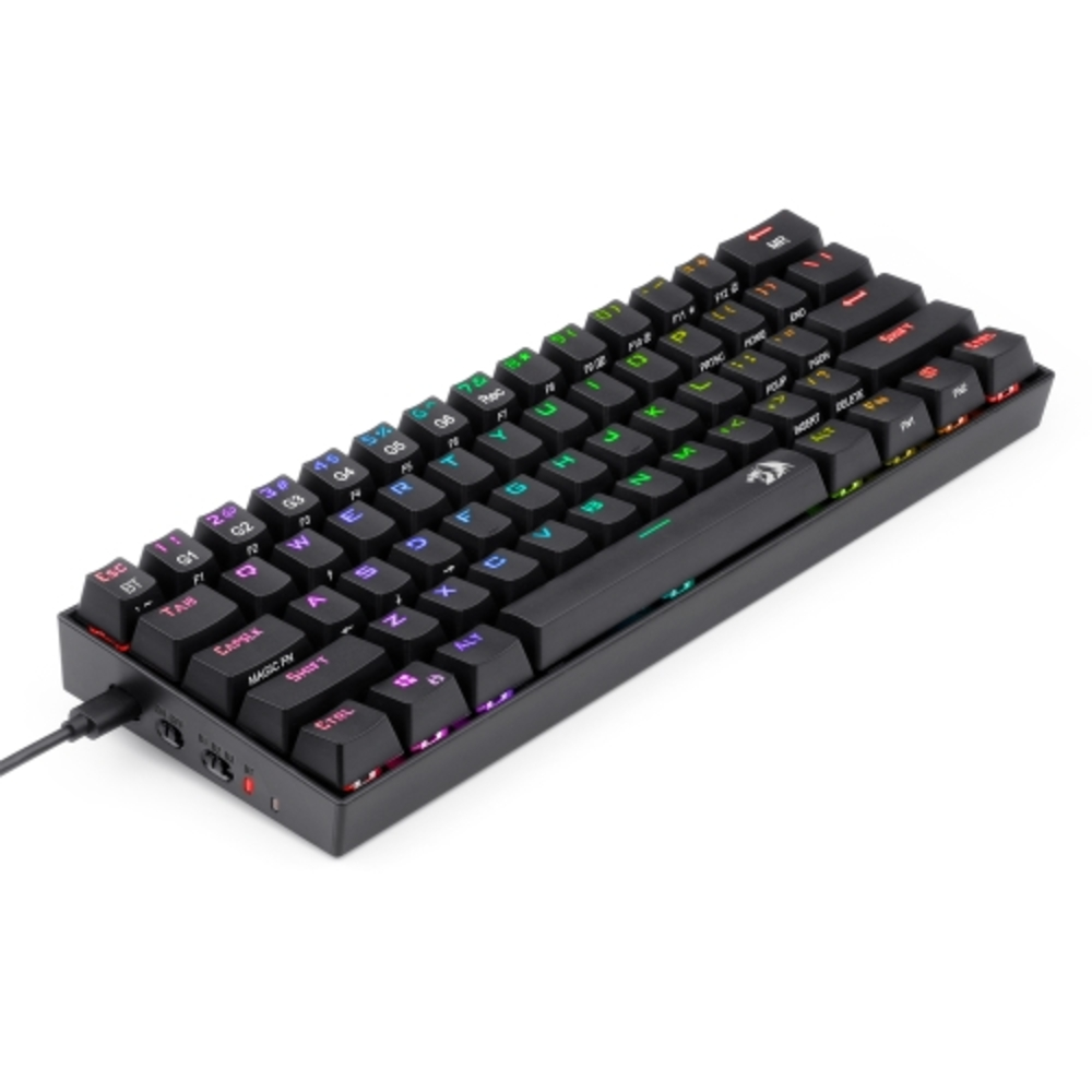 Un teclado negro con teclas coloridas y una luz roja, en ángulo para mostrar el lado.