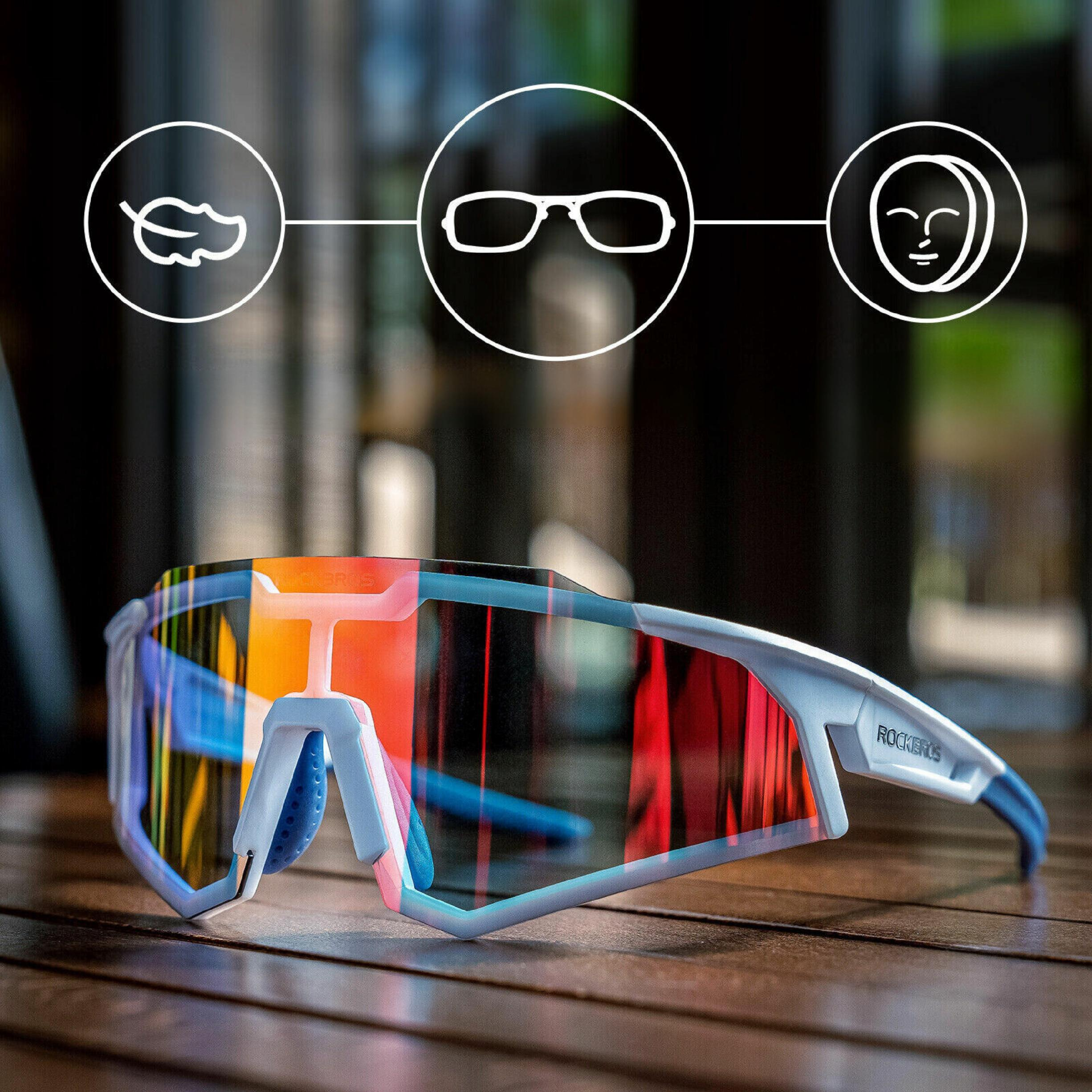 Białe sportowe okulary przeciwsłoneczne na drewnianej powierzchni, z ikonami wskazującymi lekkość, okulary i twarz.