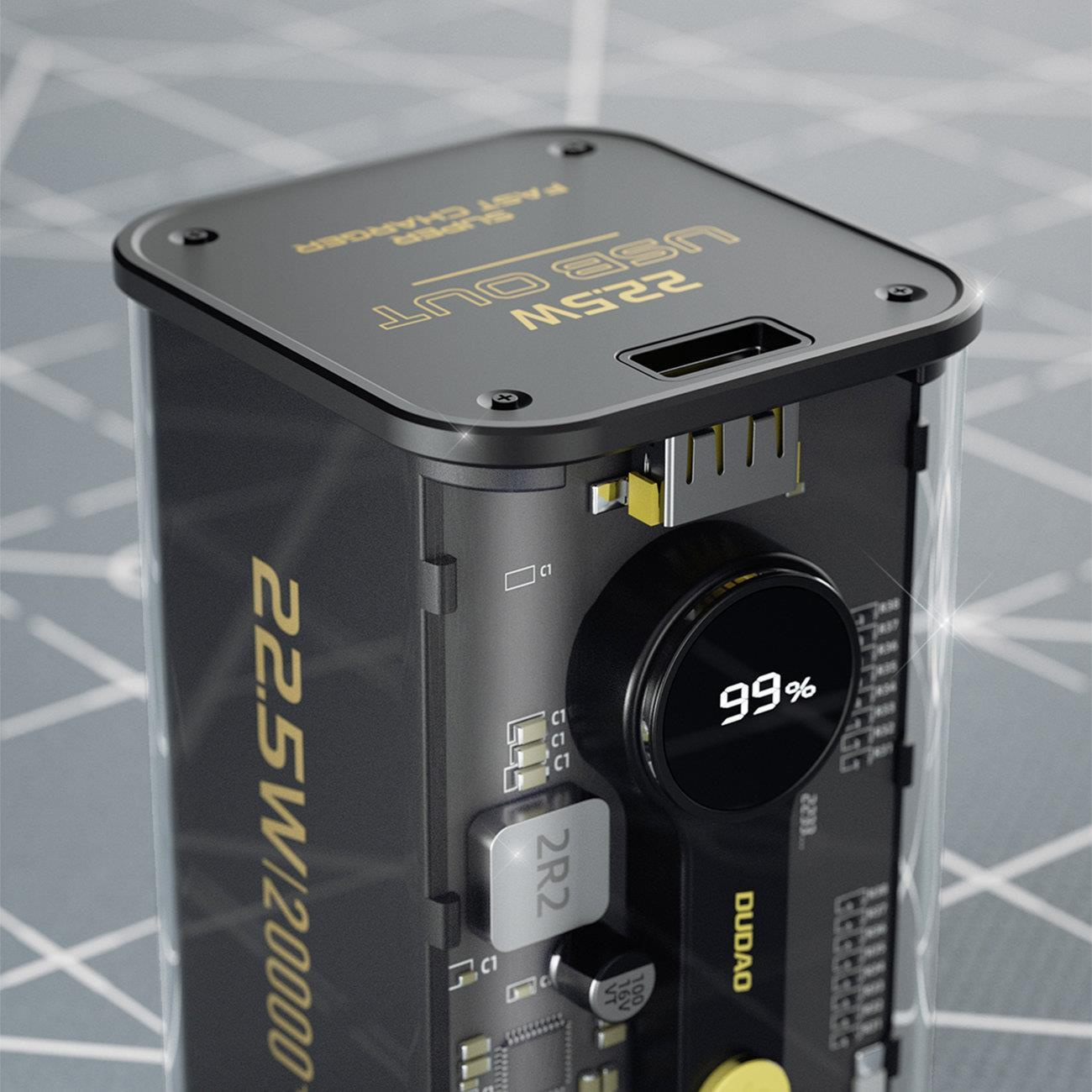 Zbliżenie power banku pokazujące "22.5W USB OUT" i 99%. Urządzenie jest czarne ze złotymi akcentami i przezroczystym fragmentem.