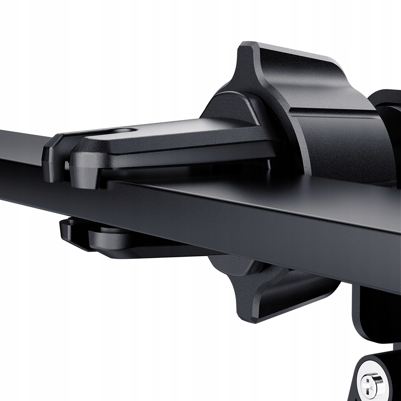 Zbliżenie czarnego uchwytu do kratki wentylacyjnej samochodu. Wykonany jest z tworzywa sztucznego i ma zazębiające się elementy.