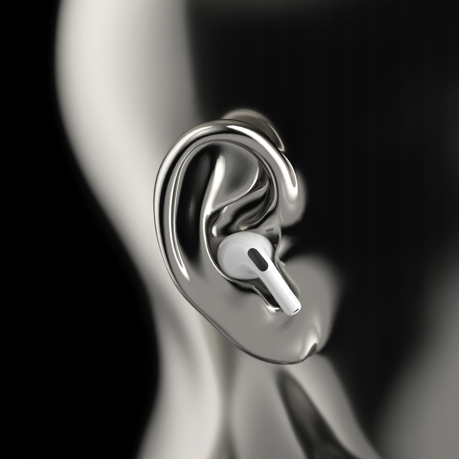 Biała słuchawka douszna w srebrnym modelu ucha, pokazująca dopasowanie słuchawki.