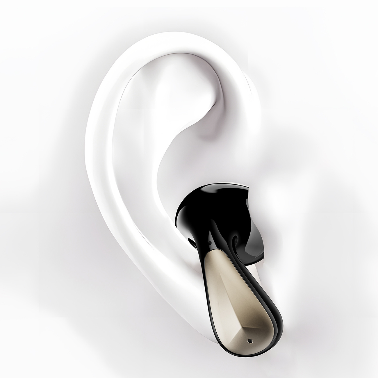 Un auricolare nero e oro viene inserito in un orecchio bianco. L'auricolare è nell'orecchio.