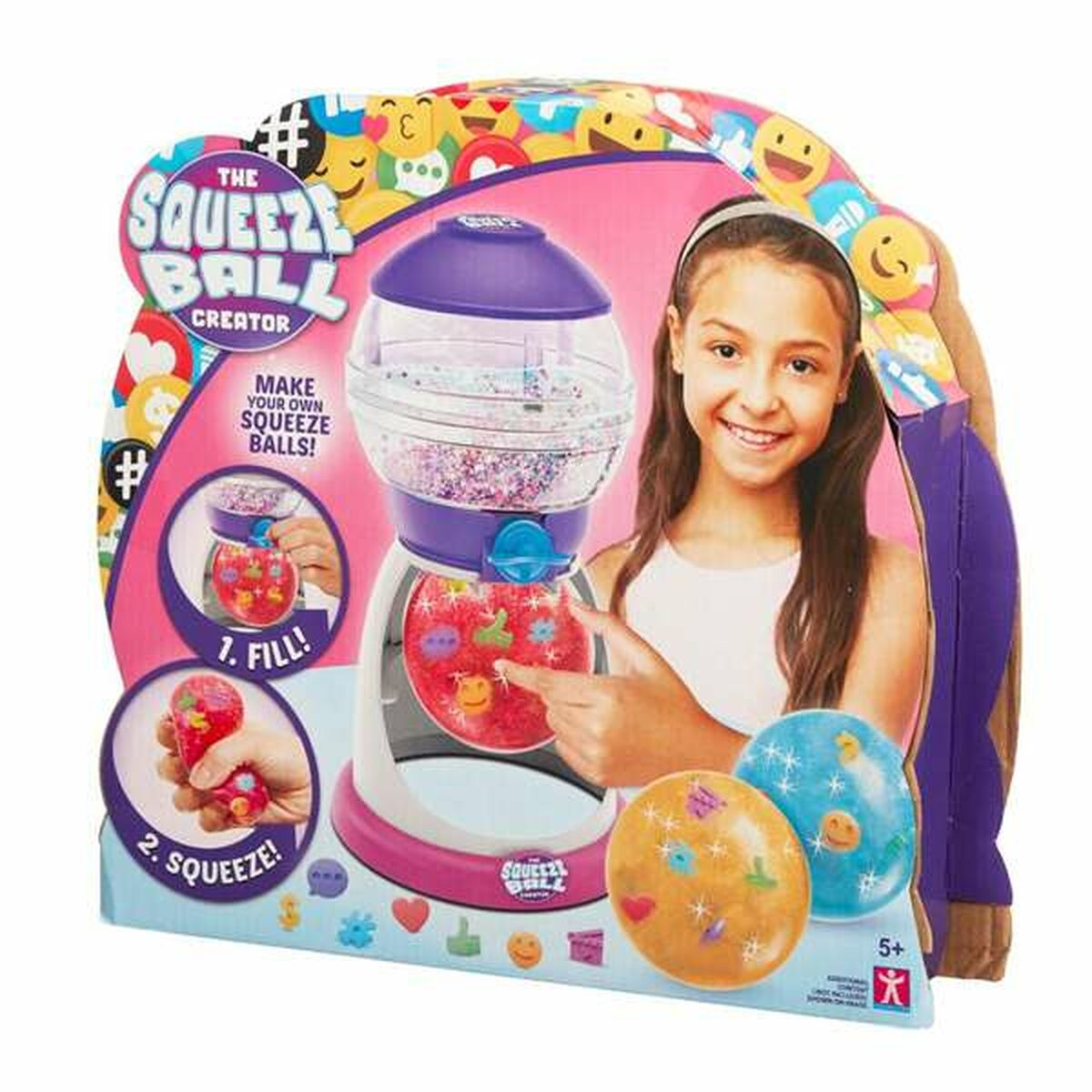 Mädchen zeigt auf eine The Squeeze Ball Creator-Box. Die Box zeigt eine Maschine und Bälle mit bunten Formen.