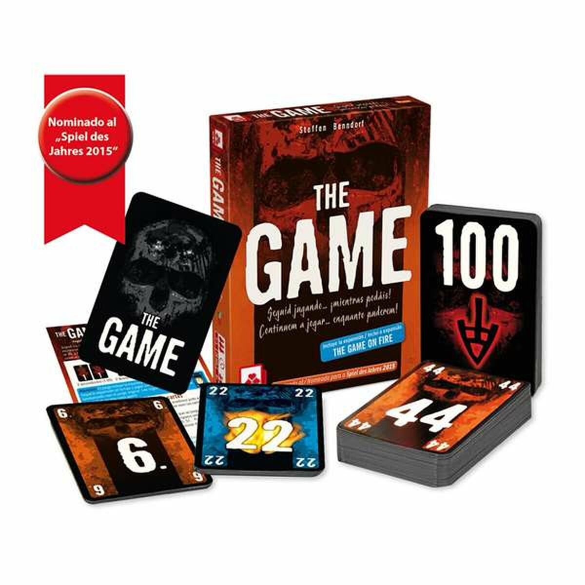 Brettspielbox und Karten. Text auf der Box: The Game. Karten zeigen Schädel und Zahlen. Nominiert für Spiel des Jahres.