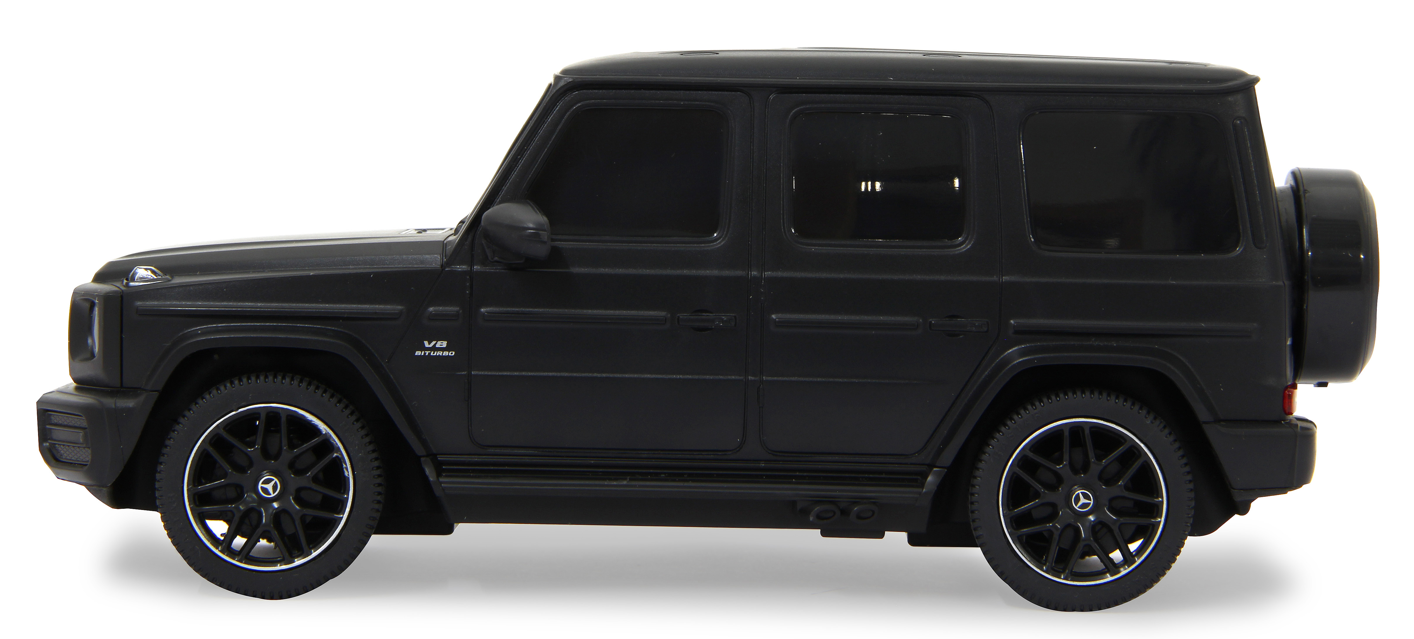 Coche de juguete negro Mercedes-Benz Clase G de lado. Ruedas negras y rueda de repuesto.
