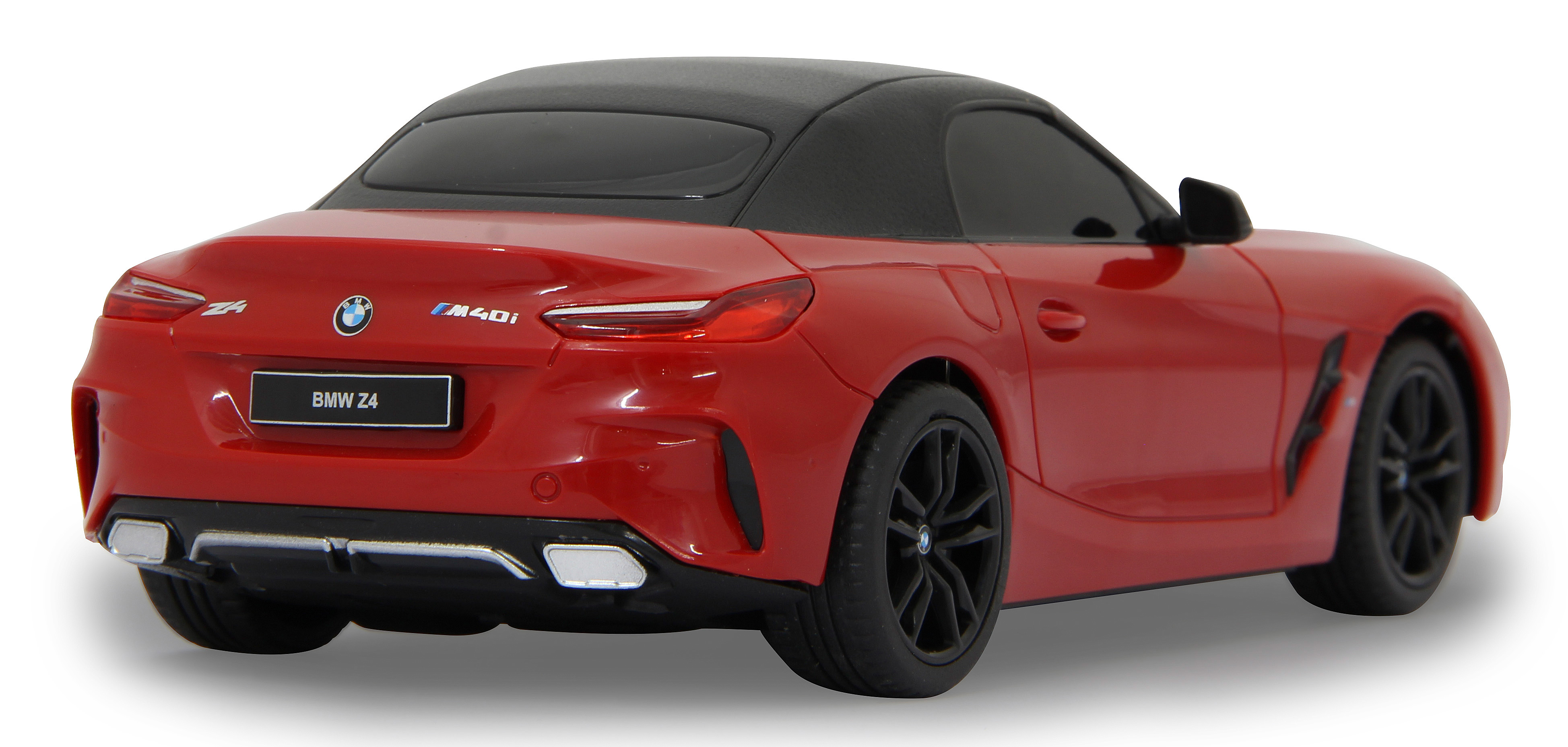 Rückansicht eines roten BMW Z4 Modellautos mit schwarzem Dach und Rädern, auf Weiß.
