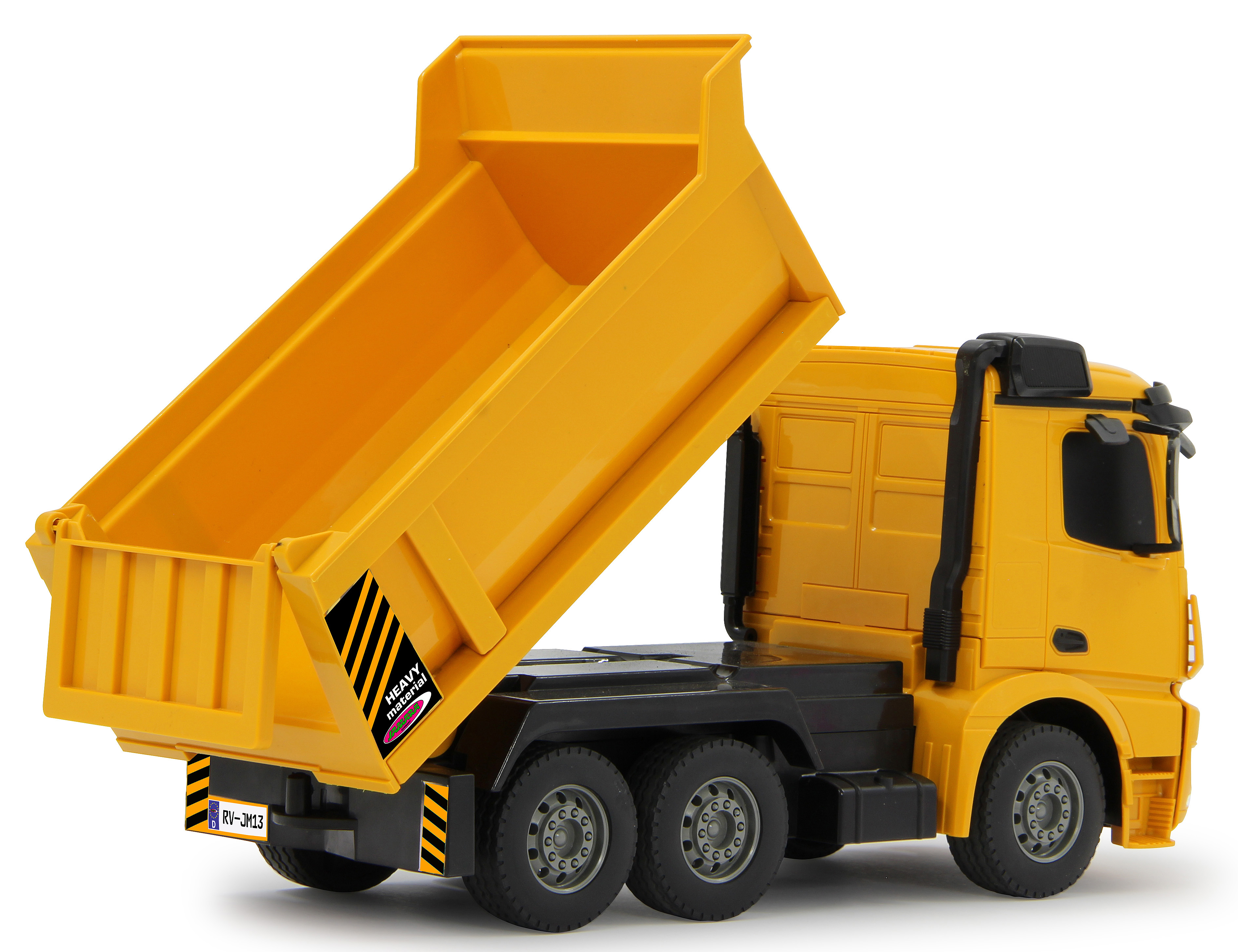 Gelber Spielzeug-Muldenkipper mit angehobener Mulde, die das schwarze Fahrgestell und das Heavy-Material-Etikett zeigt.