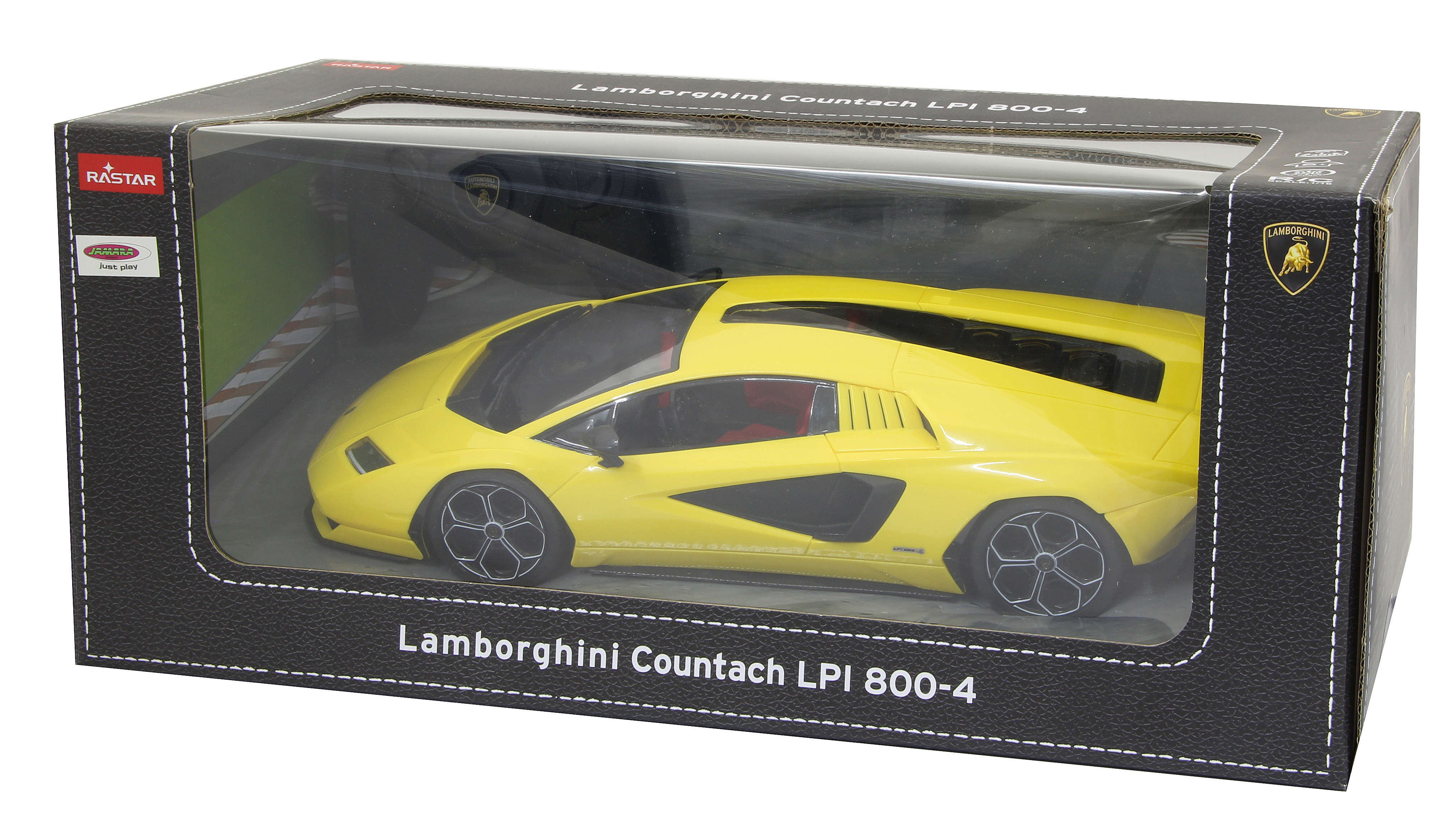 Gelbes Lamborghini Countach Spielzeugauto in einer Box, die einen Rennstreckenhintergrund zeigt.