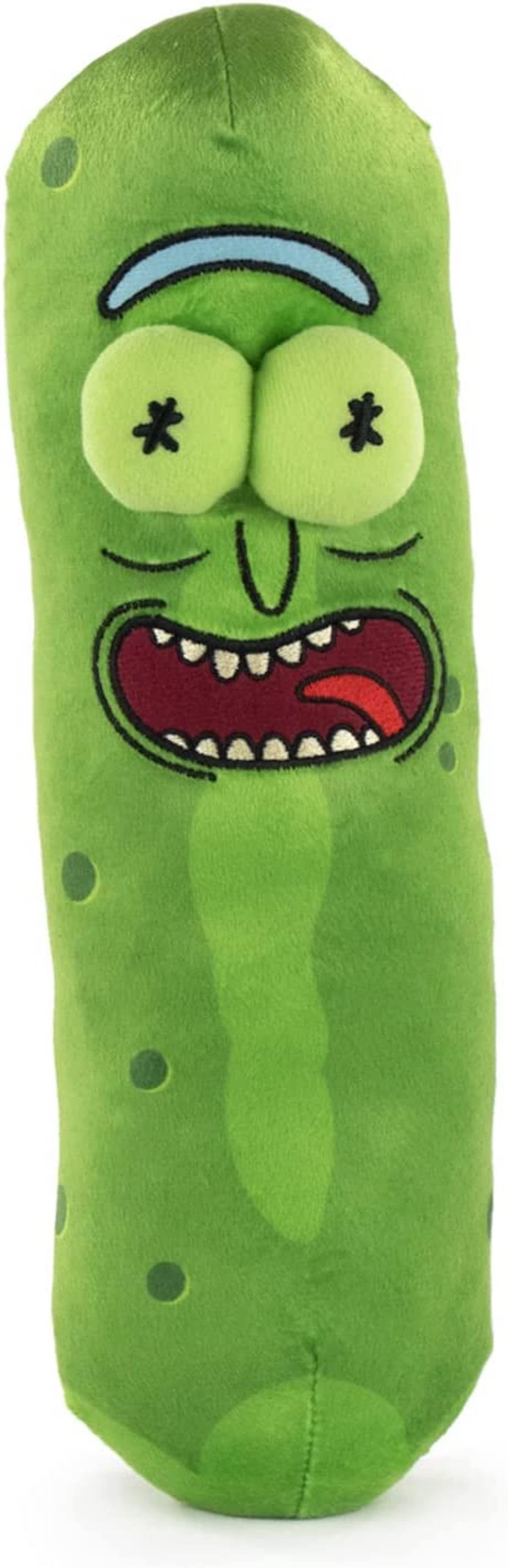 Ein grünes Essiggurken-Plüschtier mit Cartoon-Gesicht. Es hat große Augen, ein breites Lächeln und ein blaues Stirnband.