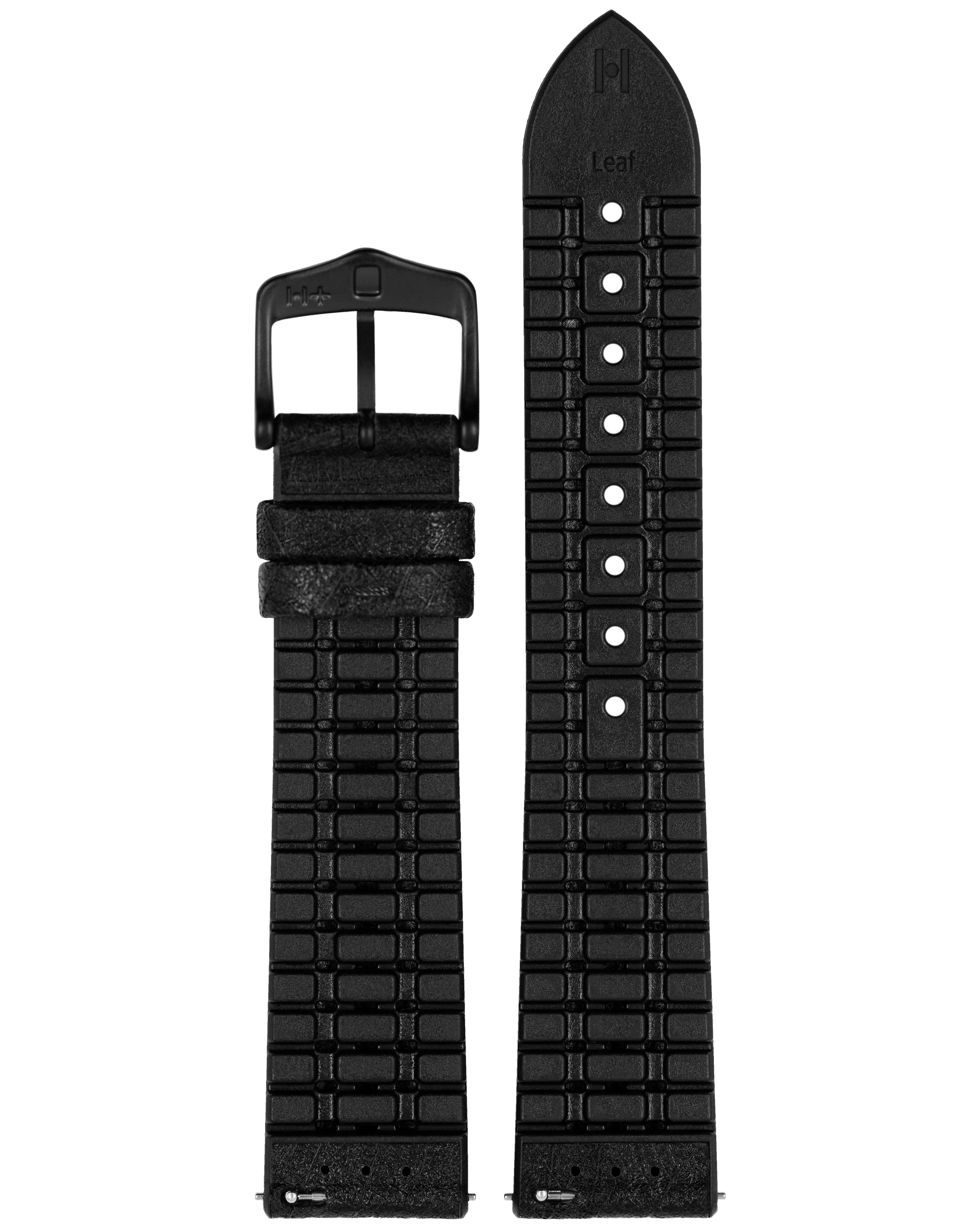 Schwarzes Uhrenarmband mit schwarzer Schnalle. Eine Seite hat ein Ziegelmuster. Die andere ein Blattmuster.