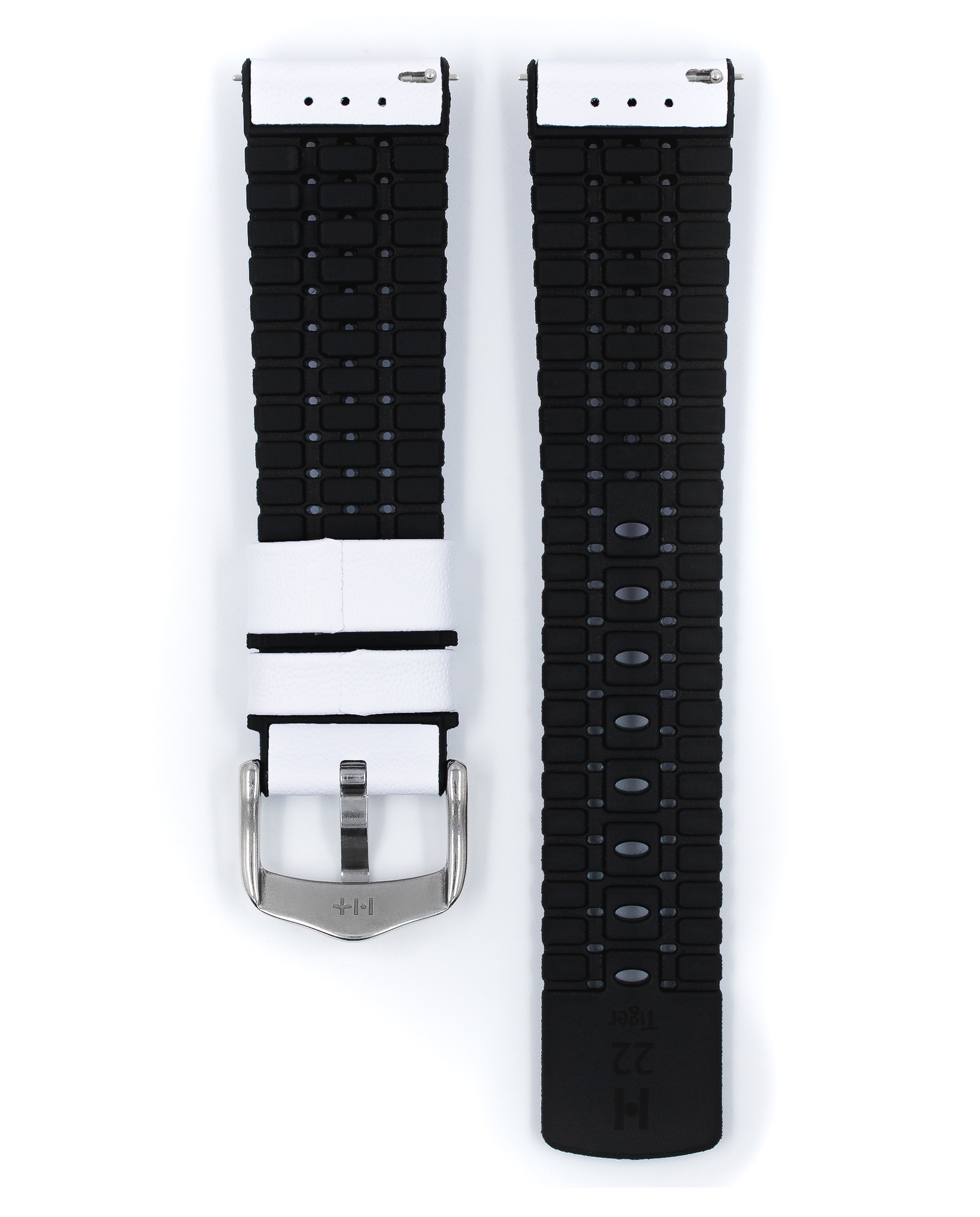 Ein weißes Uhrenarmband mit einer silbernen Schnalle. Zwei Teile ausgelegt. Schwarze Ränder.