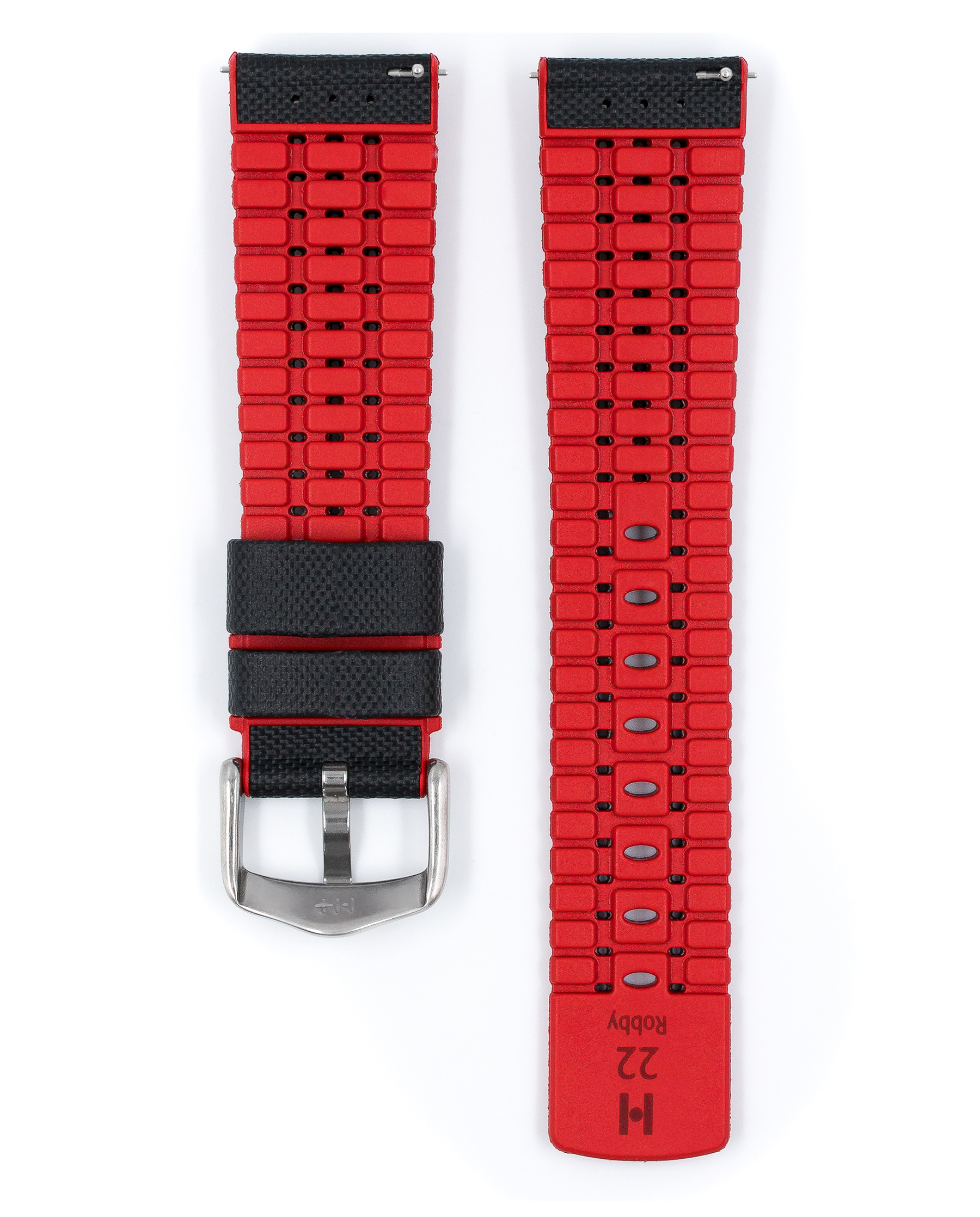 Ein rotes Uhrenarmband mit einem schwarzen Abschnitt und einer silbernen Schnalle. Zwei Teile ausgelegt.